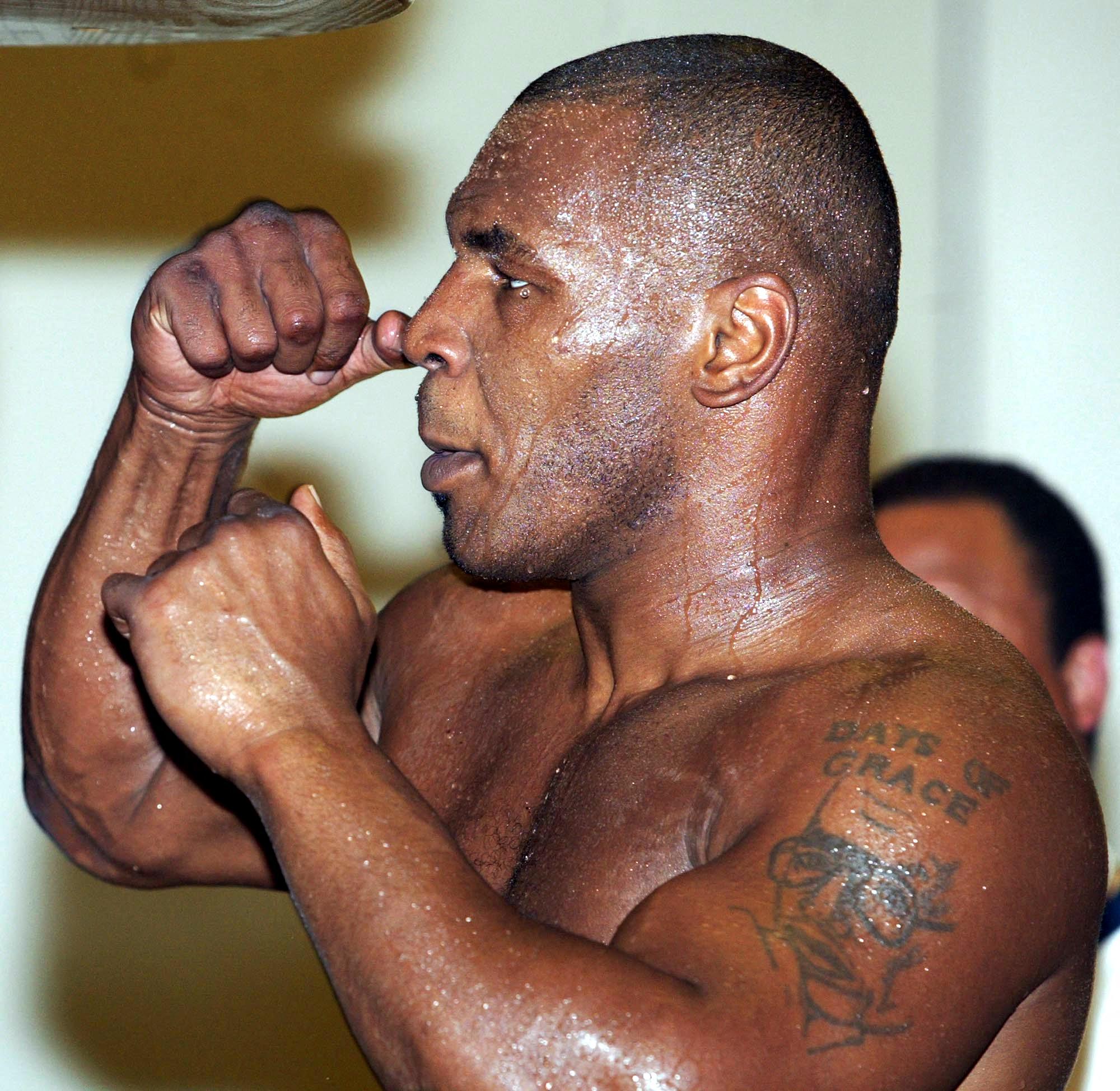 Mike Tyson punches a speed bag during a workout at the Fitzgerald Casino in Tunica, Mississippi, on June 4, 2002. | Source: Getty Images