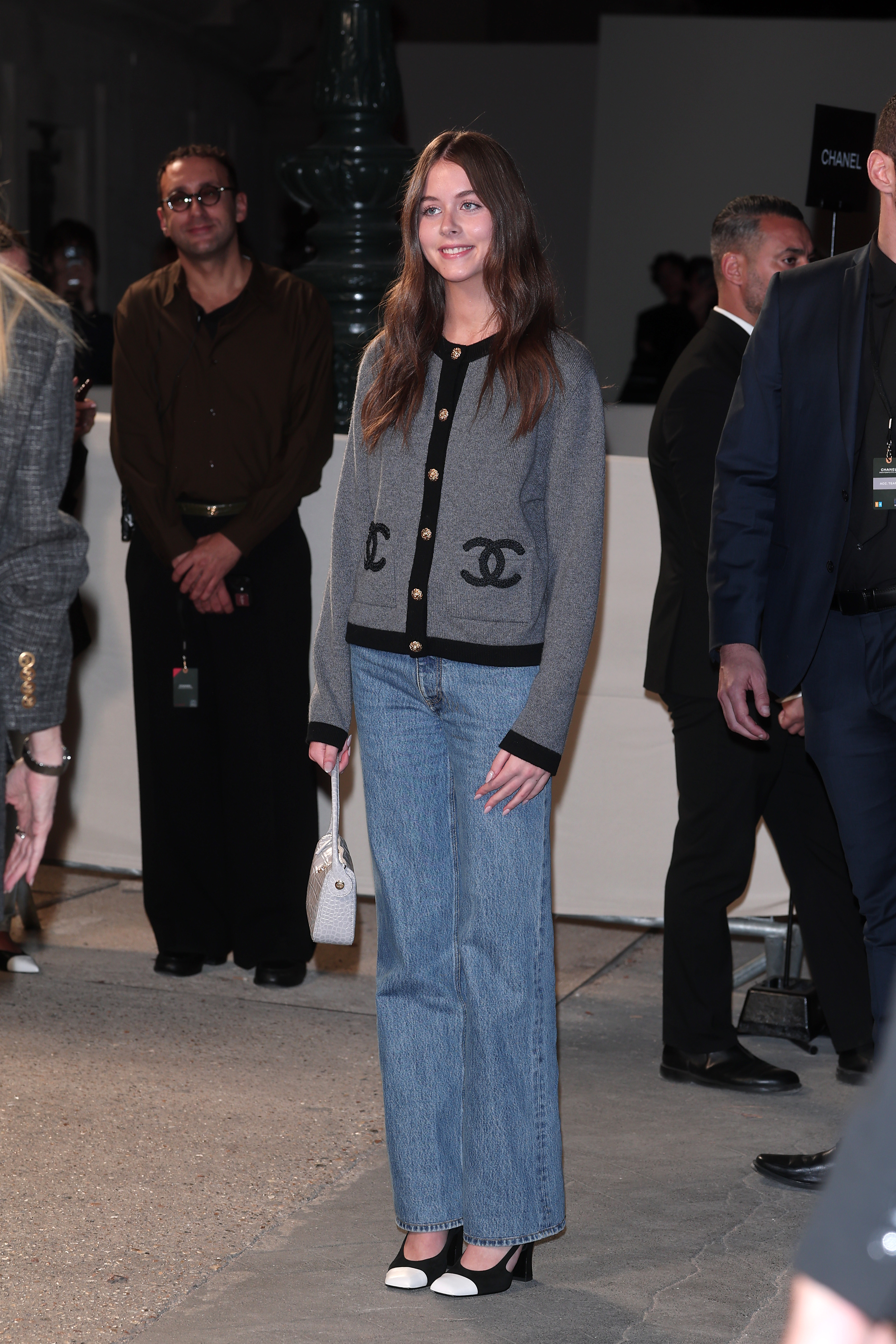 A Chanel cardigan and wide-leg denim give Faith Urban one of the more casual combinations in the lineup. She joined the arrivals for the same Spring/Summer 2027 show as her mother, Nicole Kidman.