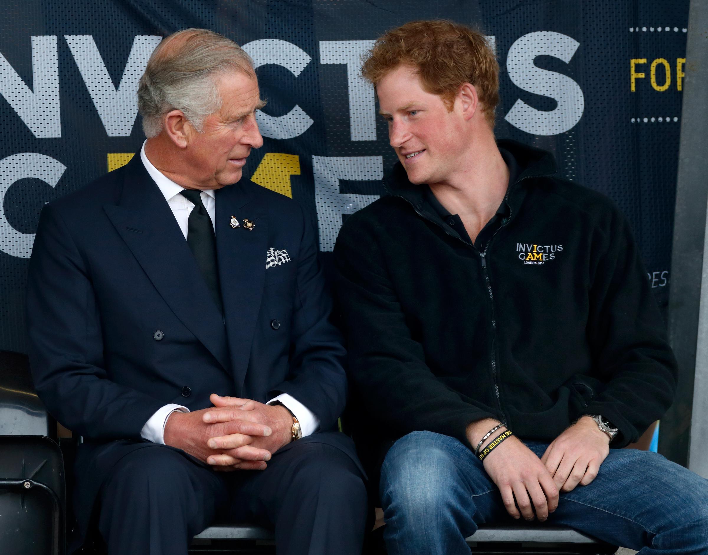King Charles III and Prince Harry share a conversation at the Invictus Games in London in 2014, years before Harry stepped back from royal duties with Meghan Markle. | Source: Getty Images