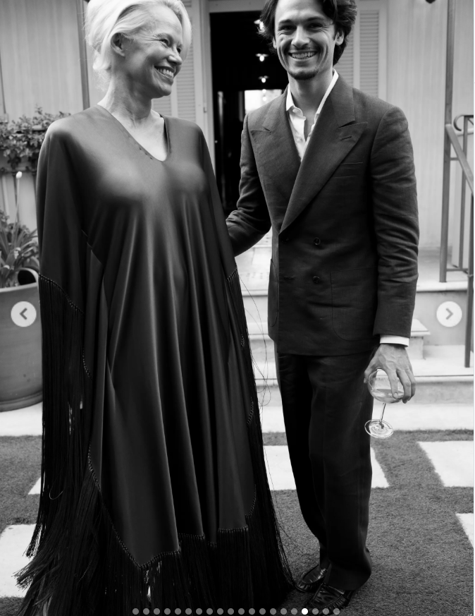 Pamela beamed beside Dylan in a candid black-and-white photo, wearing the flowing fringed dress that would soon draw attention for its color. | Source: Instagram/thierryjoubertphotography