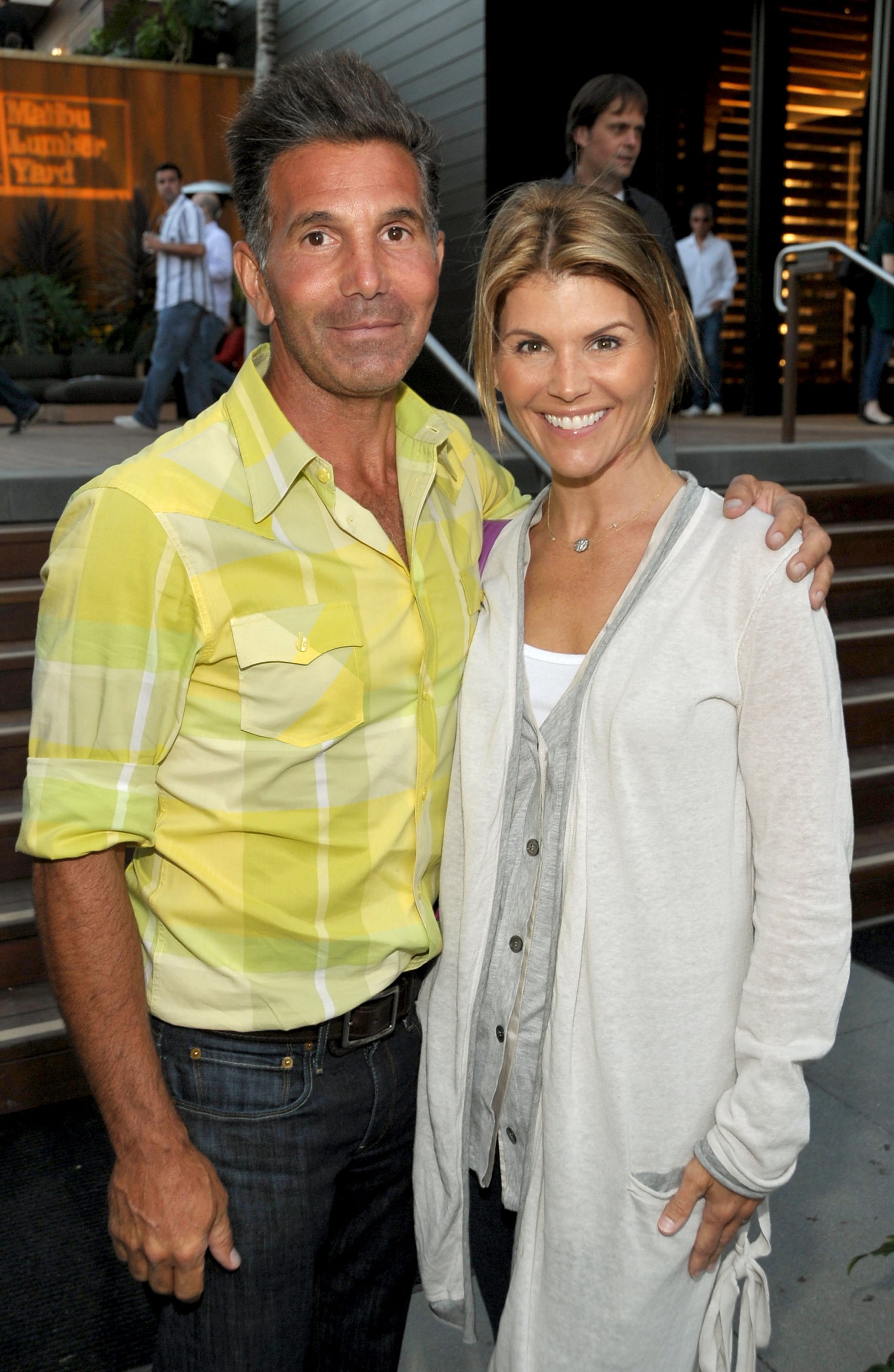 Mossimo Giannulli and Lori Loughlin attend the Malibu Lumber Yard grand opening at the Malibu Lumber Yard on April 21, 2009 in Malibu, California | Source: Getty Images