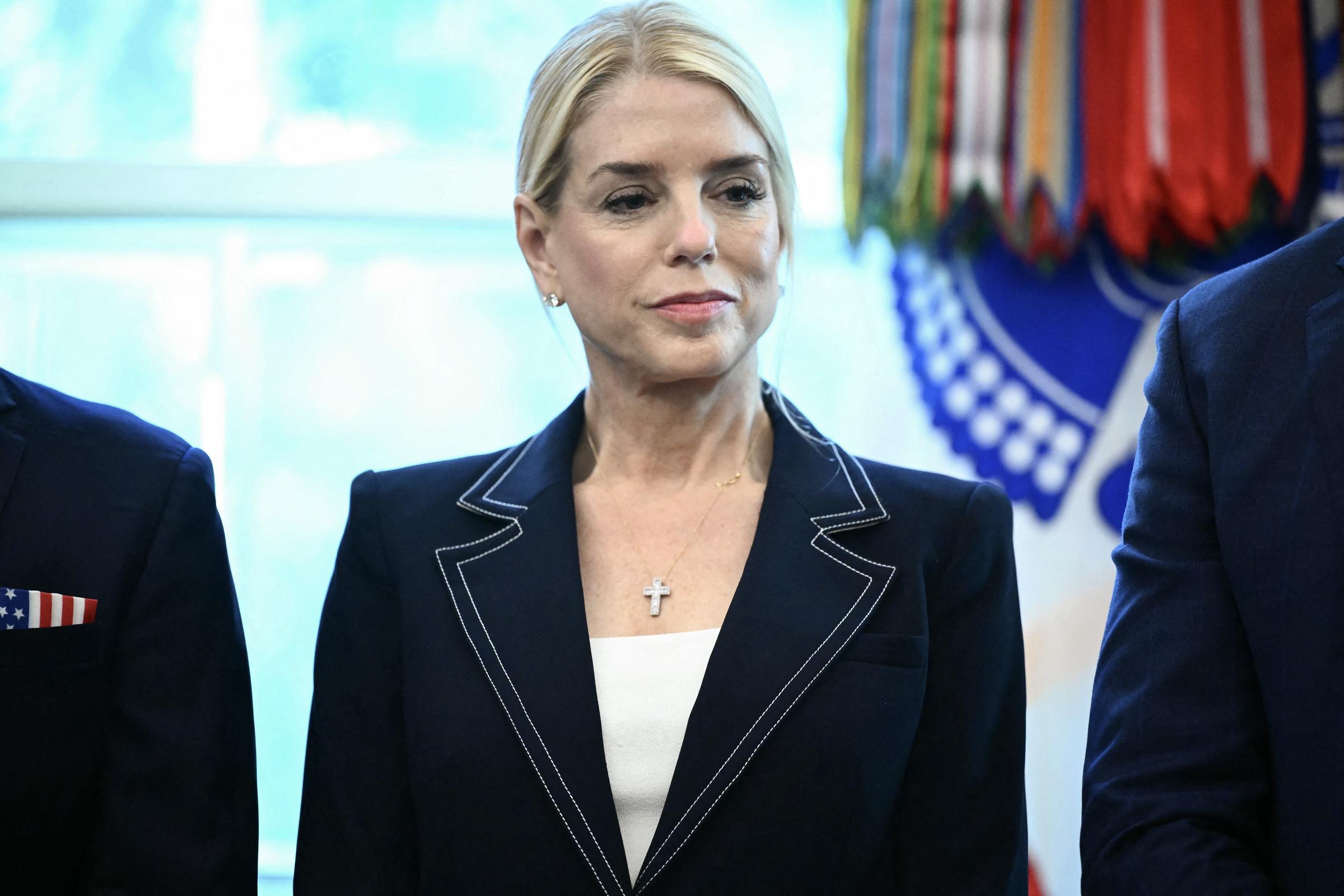 Pam Bondi looks on as President Donald Trump speaks in the Oval Office at the White House in Washington, D.C., on August 25, 2025 | Source: Getty Images