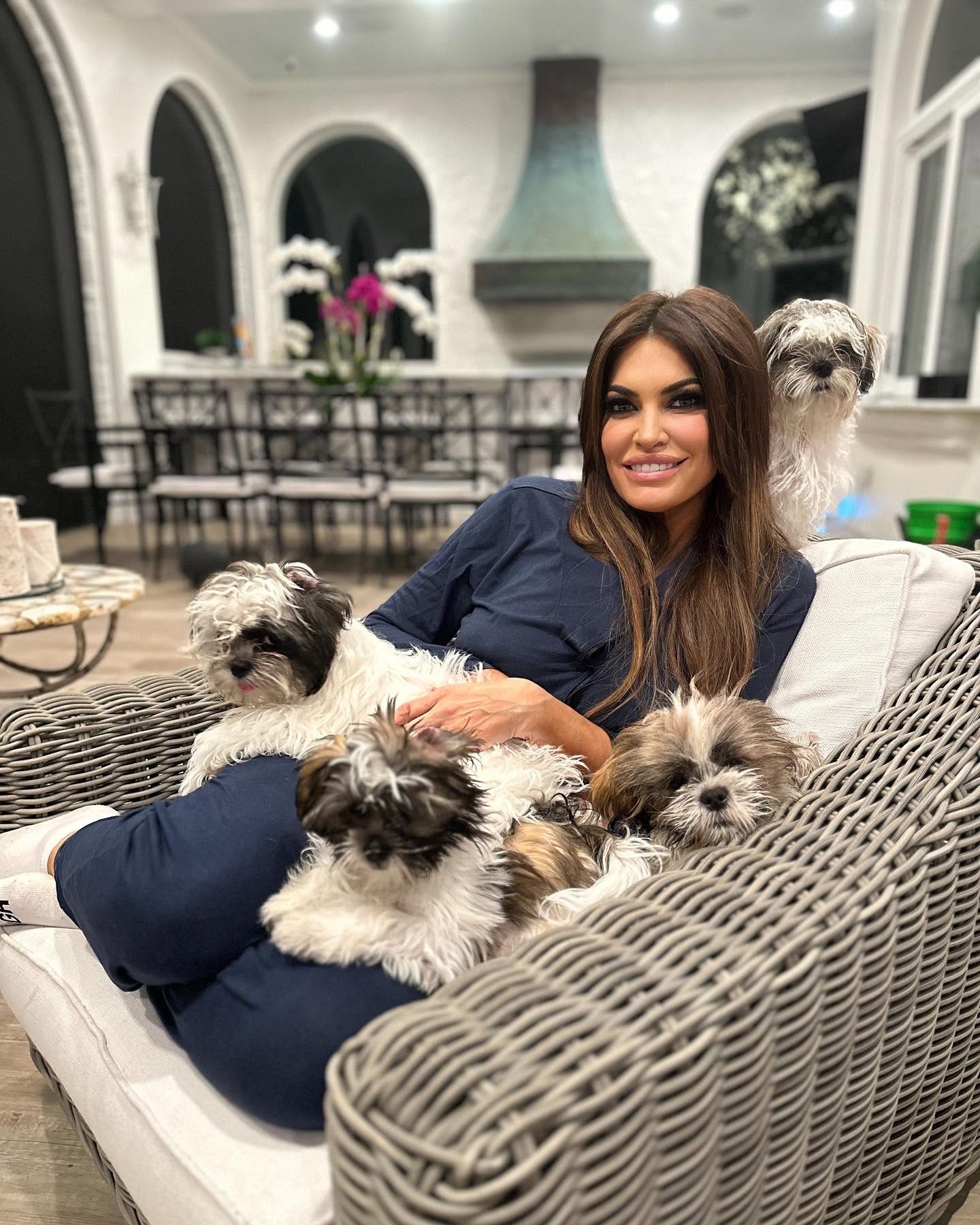 Away from her diplomatic duties, Kimberly Guilfoyle shared a glimpse of her personal life, relaxing at home surrounded by four small dogs. | Source: Facebook / Kimberly Guilfoyle.