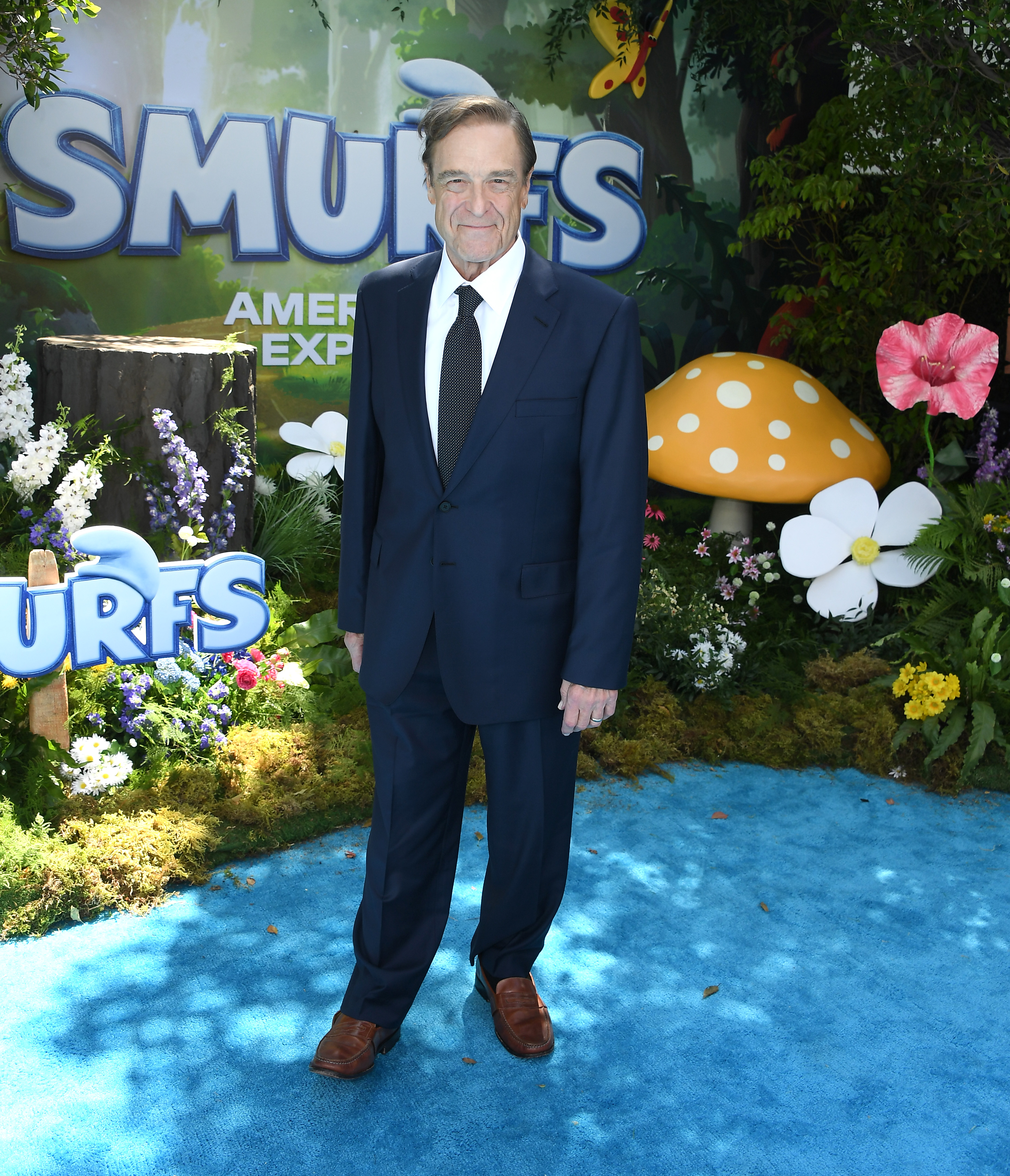 John Goodman arrives at the Los Angeles premiere of Paramount Pictures’ Smurfs at Paramount Pictures Studios on July 13, 2025, in Los Angeles, California, where he appeared noticeably slimmer nearly two decades after beginning his weight-loss journey, despite dealing with a hip injury. | Source: Getty Images