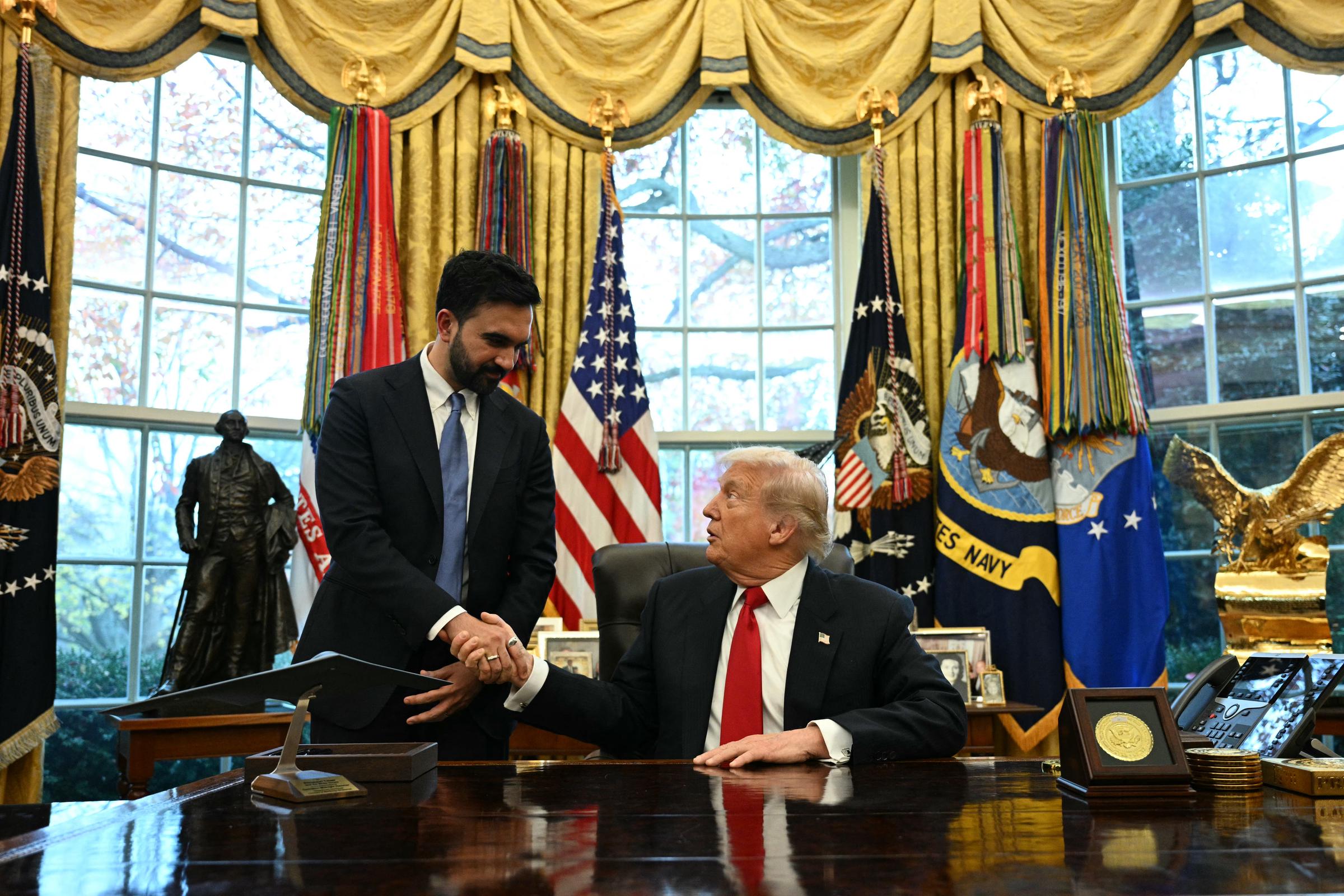 Donald Trump shakes hands with New York City Mayor-elect Zohran Mamdani during a meeting in the Oval Office of the White House on November 21, 2025 | Source: Getty Images