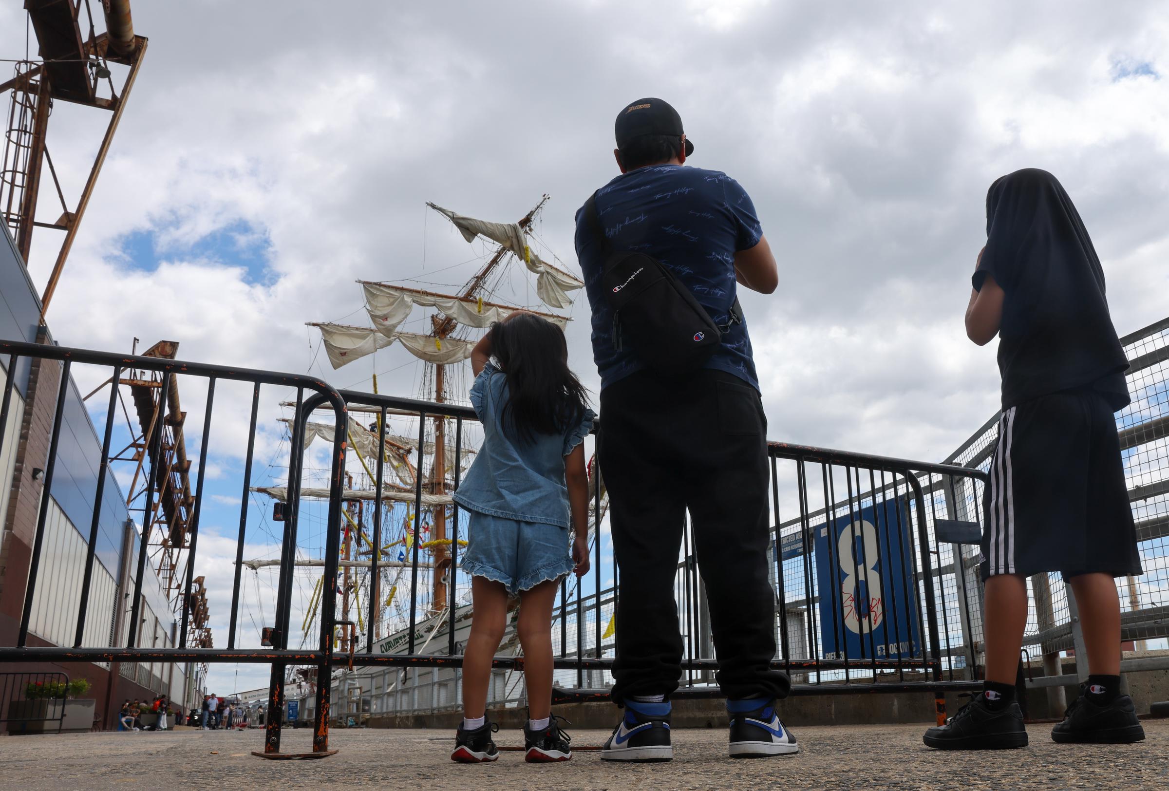 People look at the Cuauhtémoc, a Mexican Navy training ship that crashed into the Brooklyn Bridge, as it sits docked at Pier 36 in lower Manhattan on May 18, 2025 in New York City. | Source: Getty Images