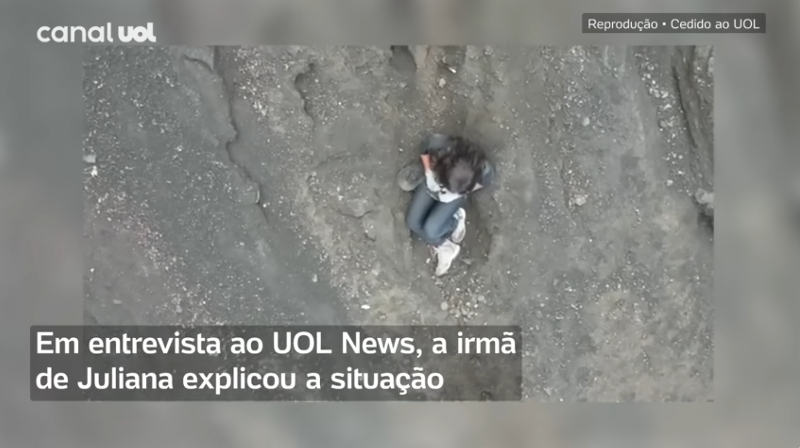 Search and rescue team finds Juliana Marins sitting and moving on a grey soil via a drone before poor weather conditions forced the team to halt the rescue, from a video dated June 23, 2025 | Source: YouTube/UOLNews