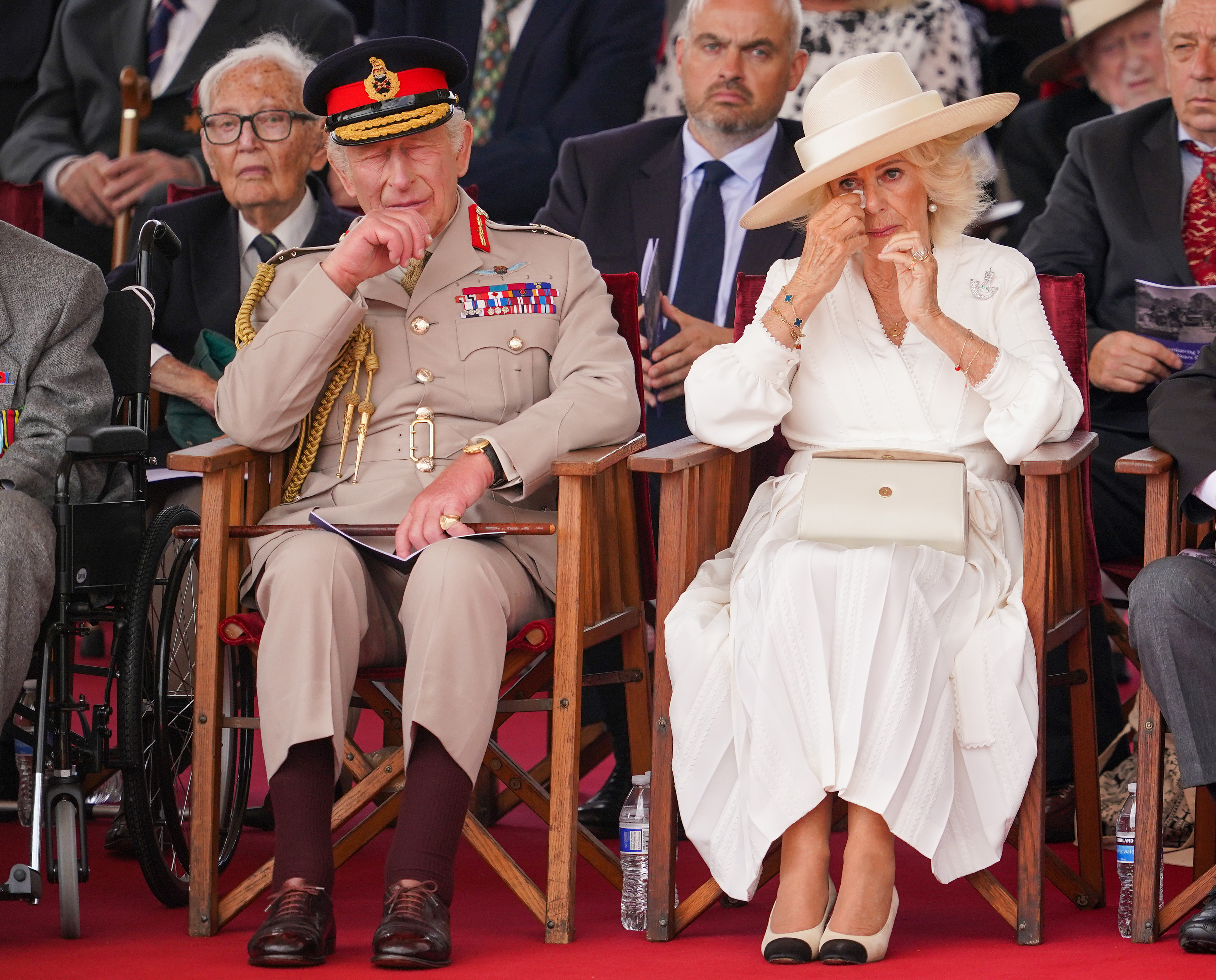 King Charles III and Queen Camilla react during a Service of Remembrance to commemorate the 80th Anniversary of VJ Day at The National Memorial Arboretum on August 15, 2025, in Alrewas, Staffordshire | Source: Getty Images