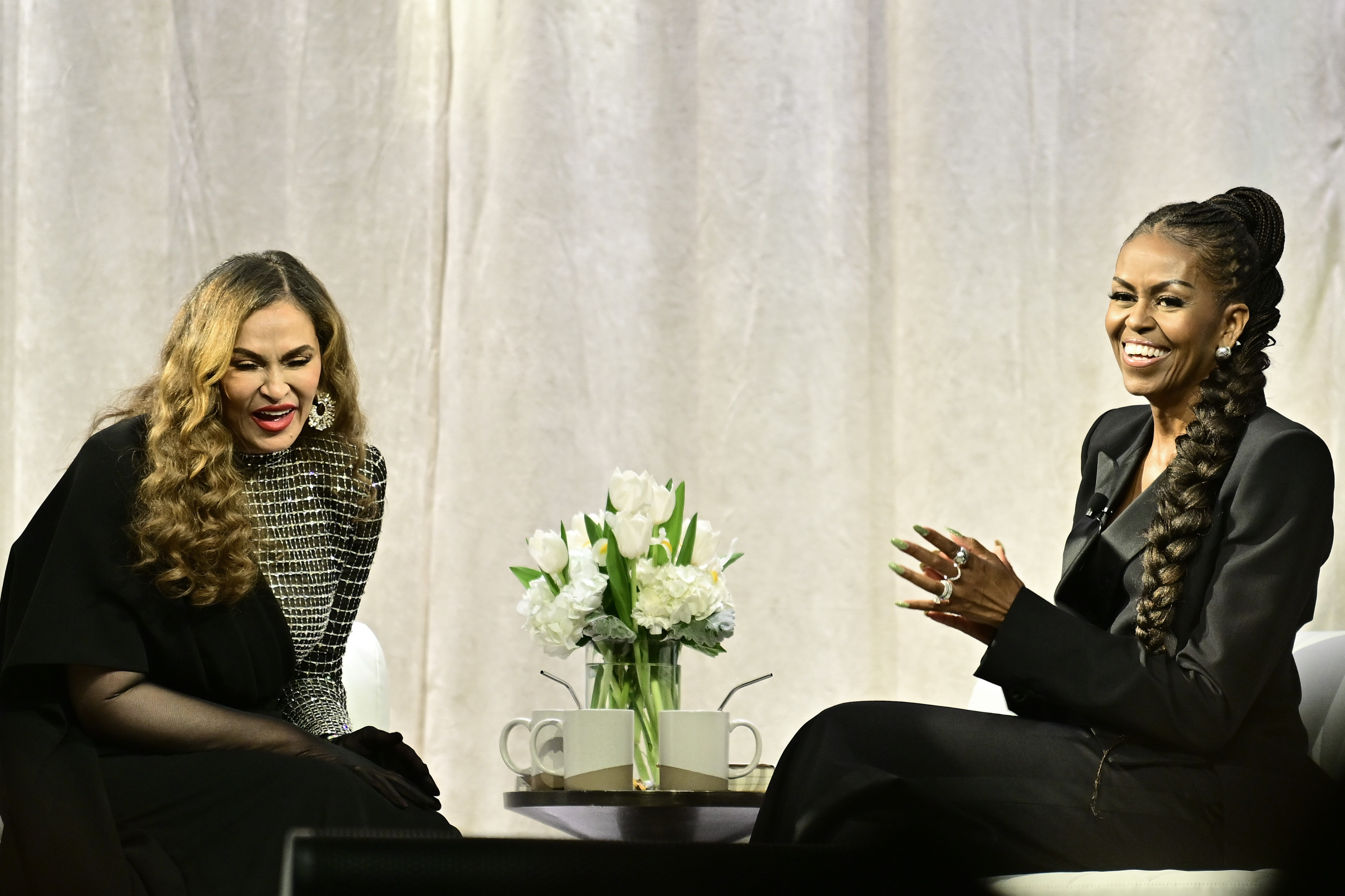 Tina Knowles discusses her memoir, "Matriarch", with former First Lady Michelle Obama at Matriarch - An Evening with Tina Knowles at The Theater at MGM National Harbor on April 30, 2025, in National Harbor, Maryland. | Source: Getty Images