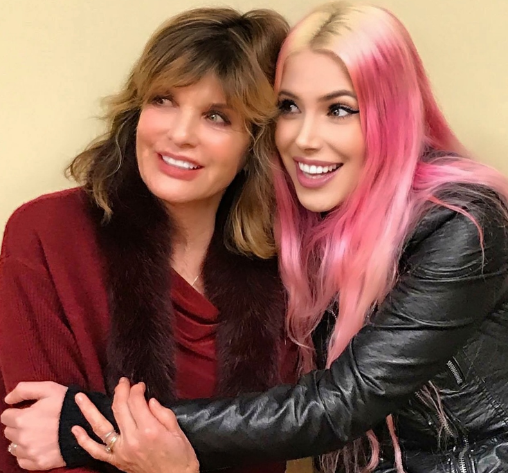 In an affectionate snapshot shared to Instagram on April 16, 2024, Cleo Rose Elliott wrapped her arm around mother Katharine Ross for a sweet mother-daughter portrait. Katharine looked radiant in a deep burgundy cardigan trimmed with a plush faux-fur collar, while Cleo beamed beside her, debuting vibrant pastel pink hair styled with a classic black leather motorcycle jacket. | Source: Instagram/cleoroseelliott