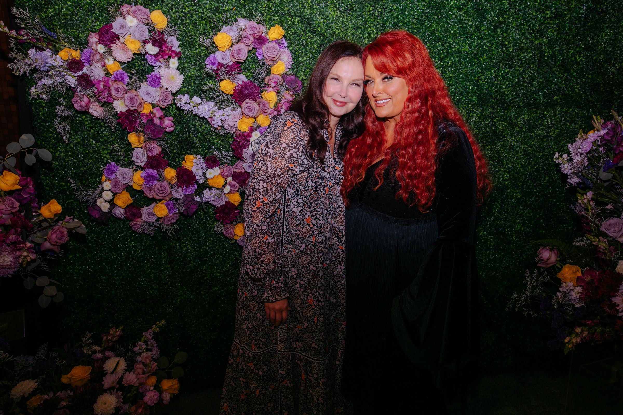 Ashley and Wynonna Judd pose together backstage at a tribute to Loretta Lynn at Nashville's Grand Ole Opry on October 30, 2022. That same month, Wynonna described her relationship with Ashley as the most powerful in her life. | Source: Getty Images