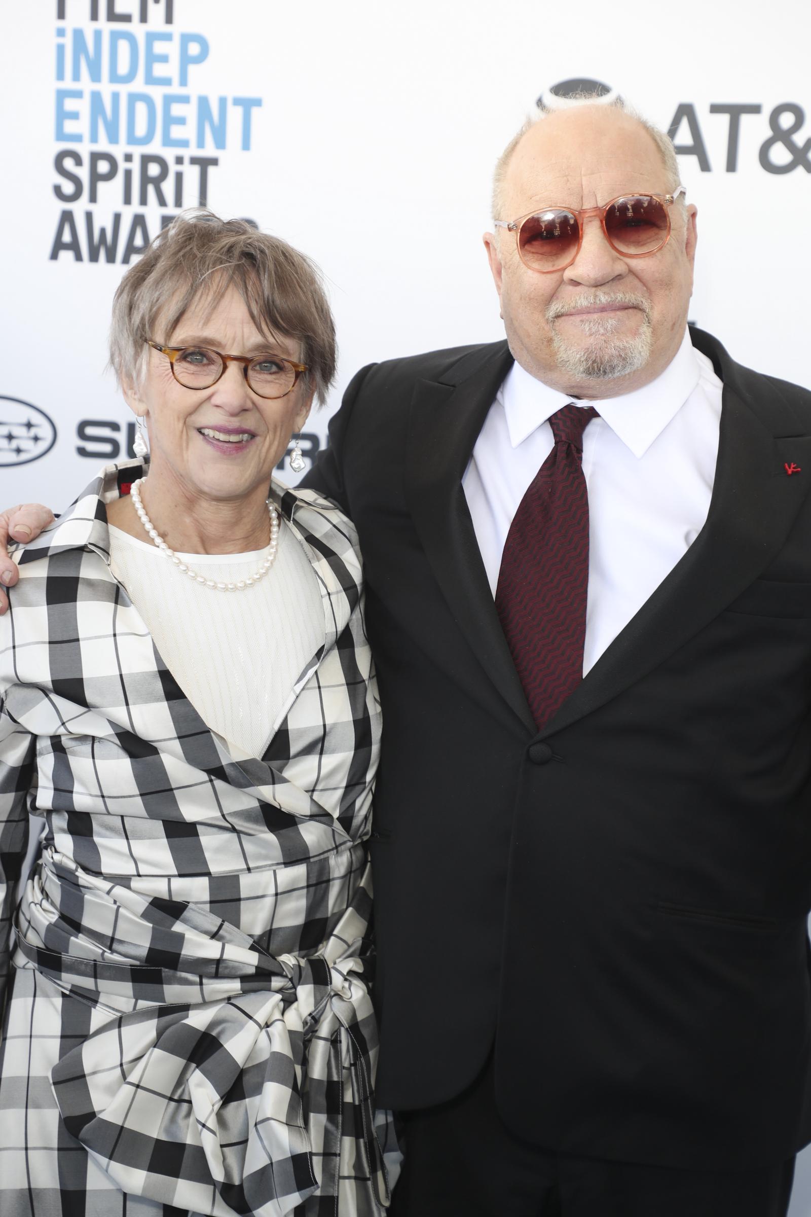 Mary Beth Hurt poses with Paul Schrader at the 2019 Film Independent Spirit Awards in Los Angeles. In a black-and-white checked dress, pearls, and tinted glasses, Hurt looked bright and elegant beside her filmmaker husband.