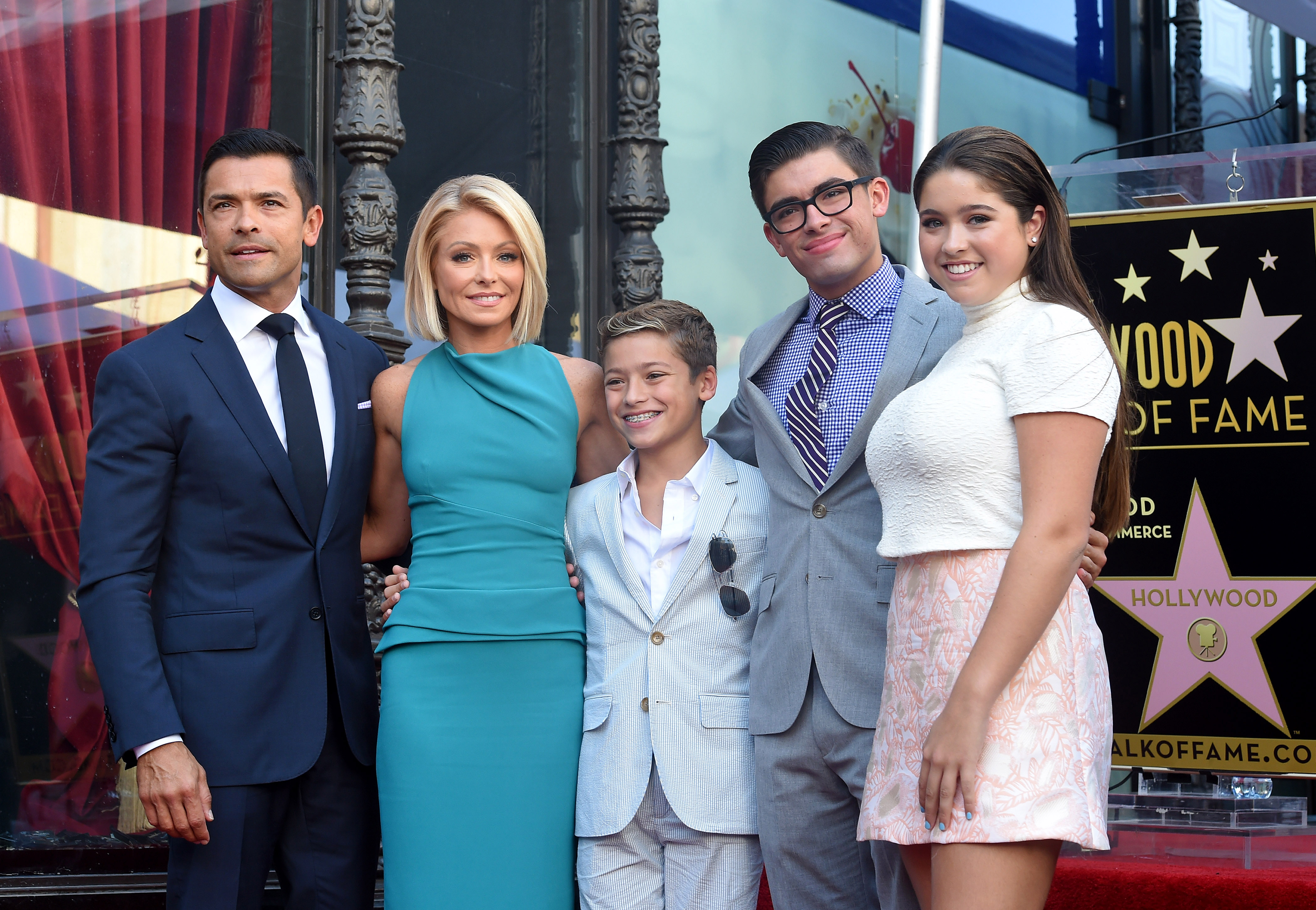 Kelly Ripa and Mark Consuelos pose with their children, Lola, Michael and Joaquin Consuelos, as Kelly is honored with a star on the Hollywood Walk of Fame in Hollywood, California, on October 12, 2015. | Source: Getty Images