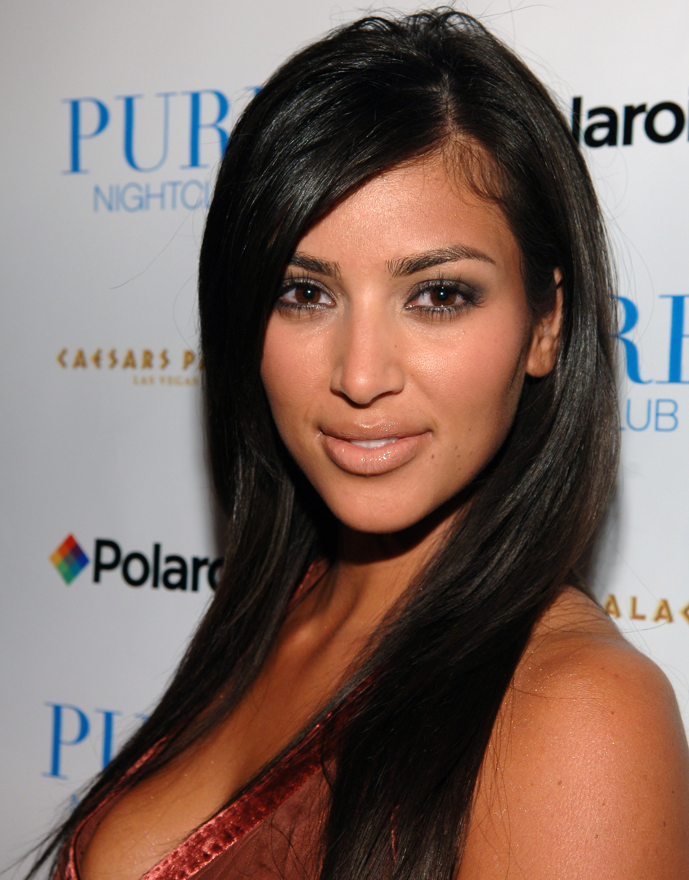 Kim Kardashian, 25, presented a full, rounded facial structure, featuring a prominent nose bridge, naturally full cheeks, and a soft jawline, while attending the Matt Leinart Draft Party at Pure Nightclub on May 2, 2006, in Las Vegas, Nevada.