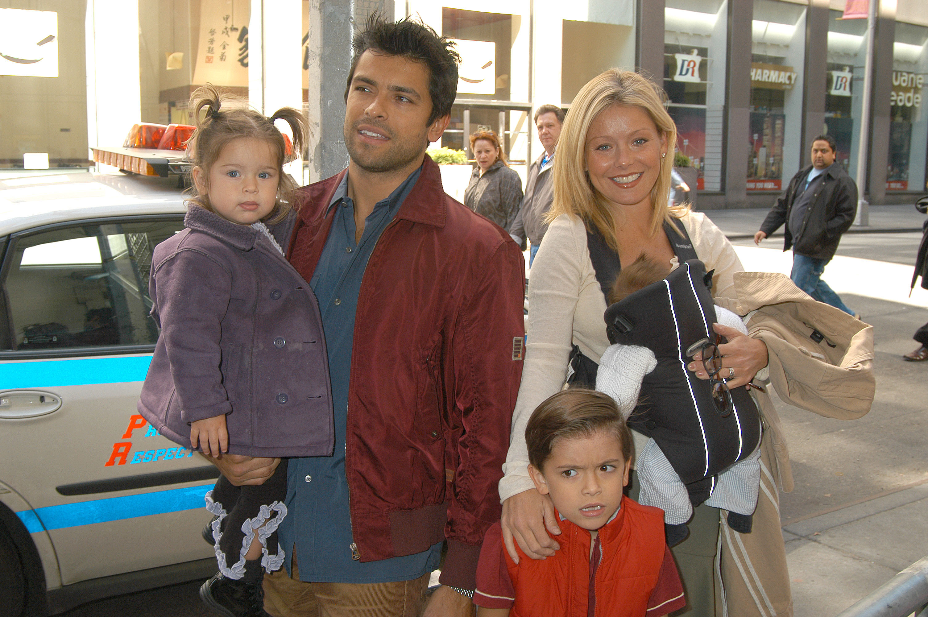 When Joaquin was still a baby, Kelly and Mark took their three children to a Broadway opening. The family photograph captured a rare public moment from their earliest years as parents of five. | Source: Getty Images