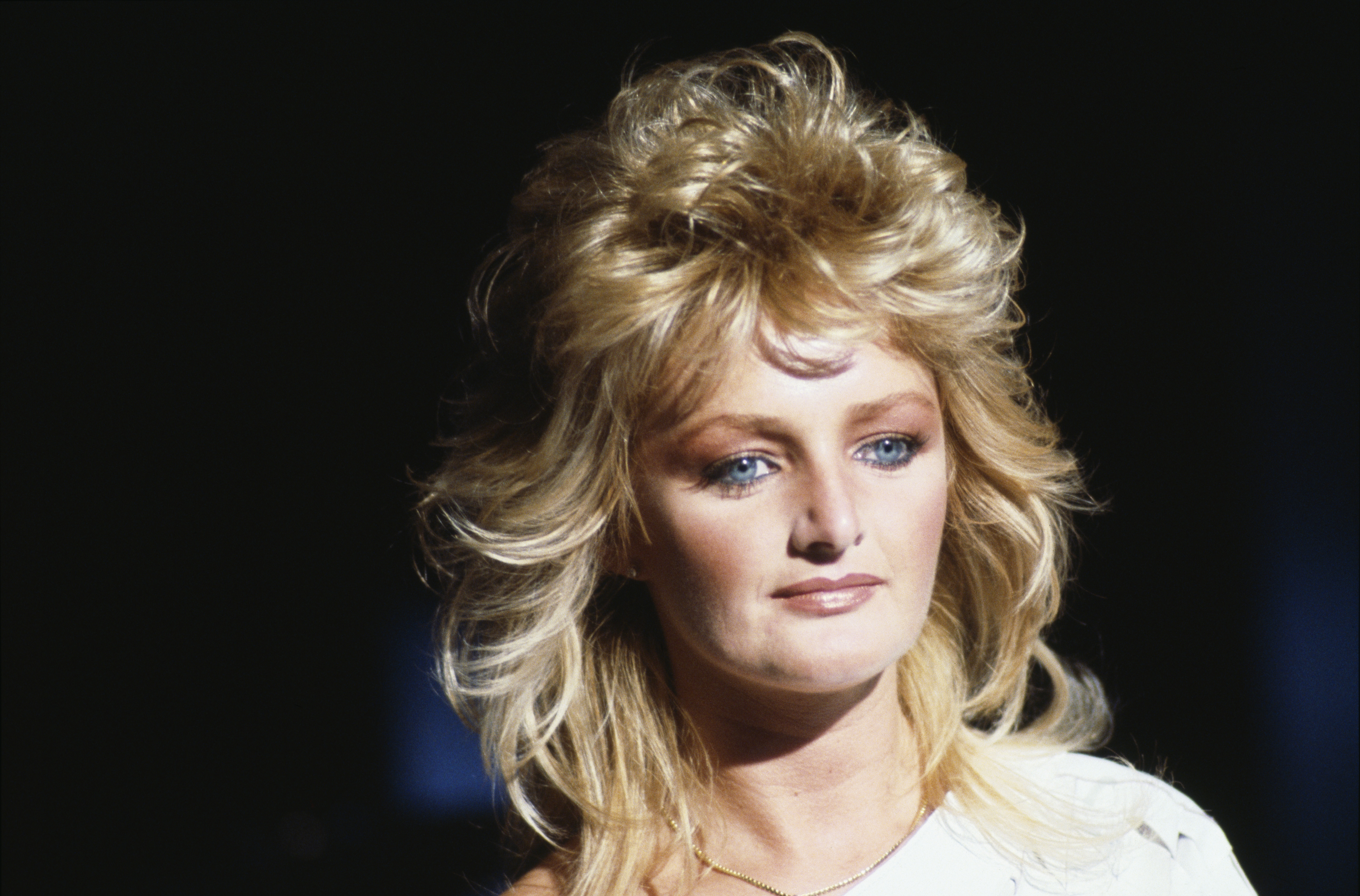 A young Bonnie Tyler appears in a striking close-up, years after her early dream of simply singing in a band led to a chance discovery in a Swansea club and the start of her recording career. | Source: Getty Images