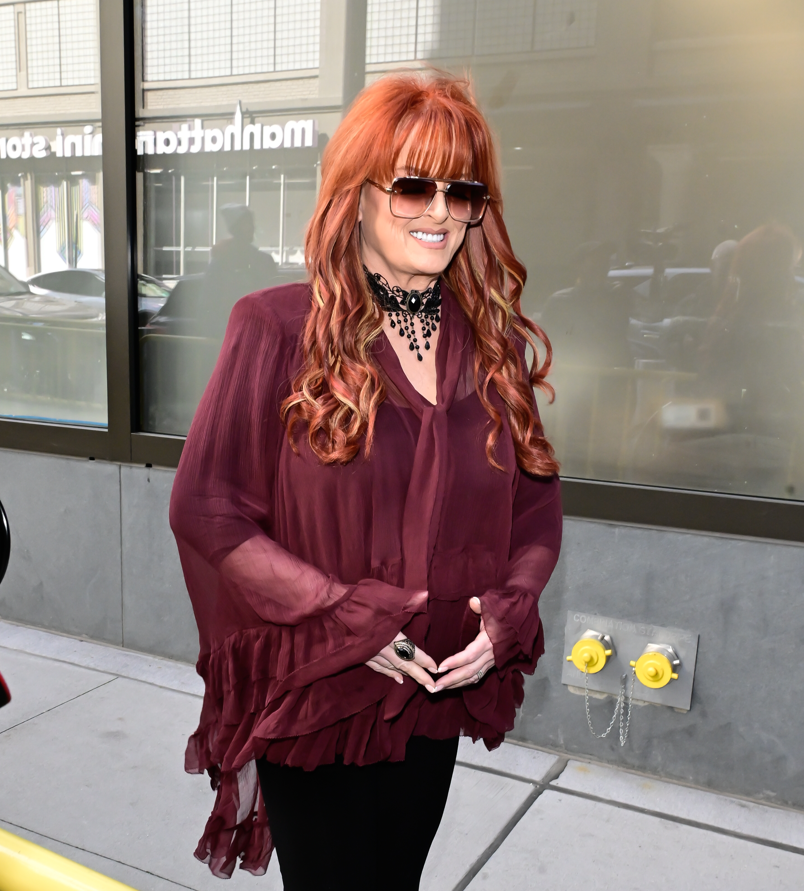 Wynonna was photographed outside ABC Studios in New York City on October 5, wearing a flowing burgundy top, black pants, and sunglasses. The image offered a closer look at the singer during one of her latest public appearances.
