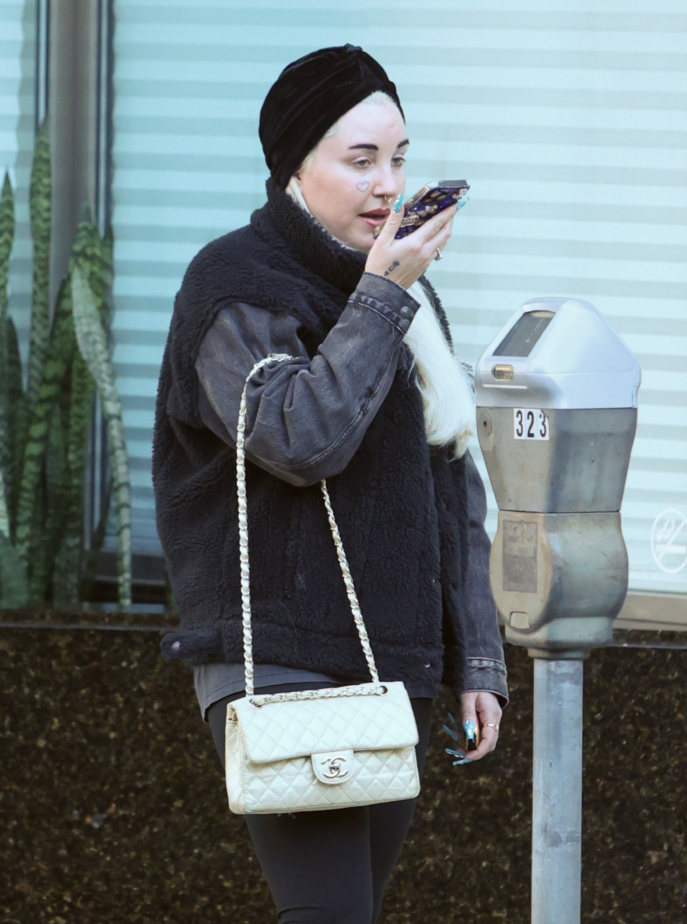 Amanda Bynes was spotted on January 9, 2024, in Beverly Hills, keeping it low-key in cozy layers and a turban wrap, speaking into her phone with a vintage Chanel bag slung over her shoulder.