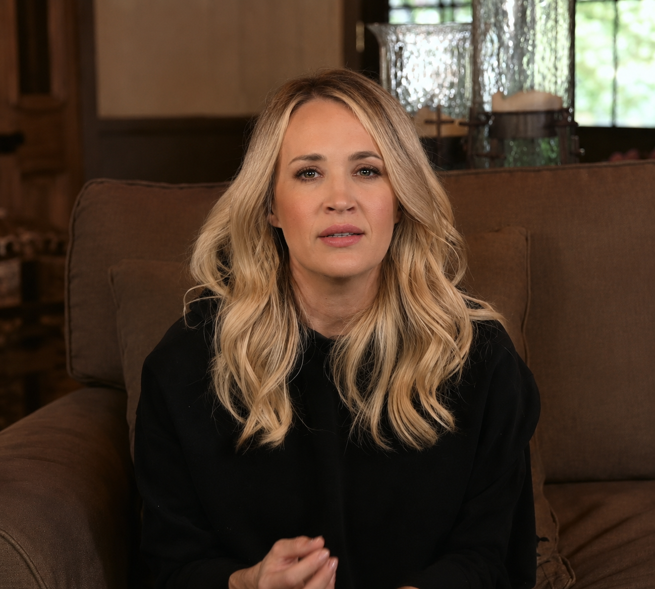 AI-generated portrait imagining Carrie Underwood with darker blonde hair, loose waves, and natural-looking makeup. | Source: ChatGPT