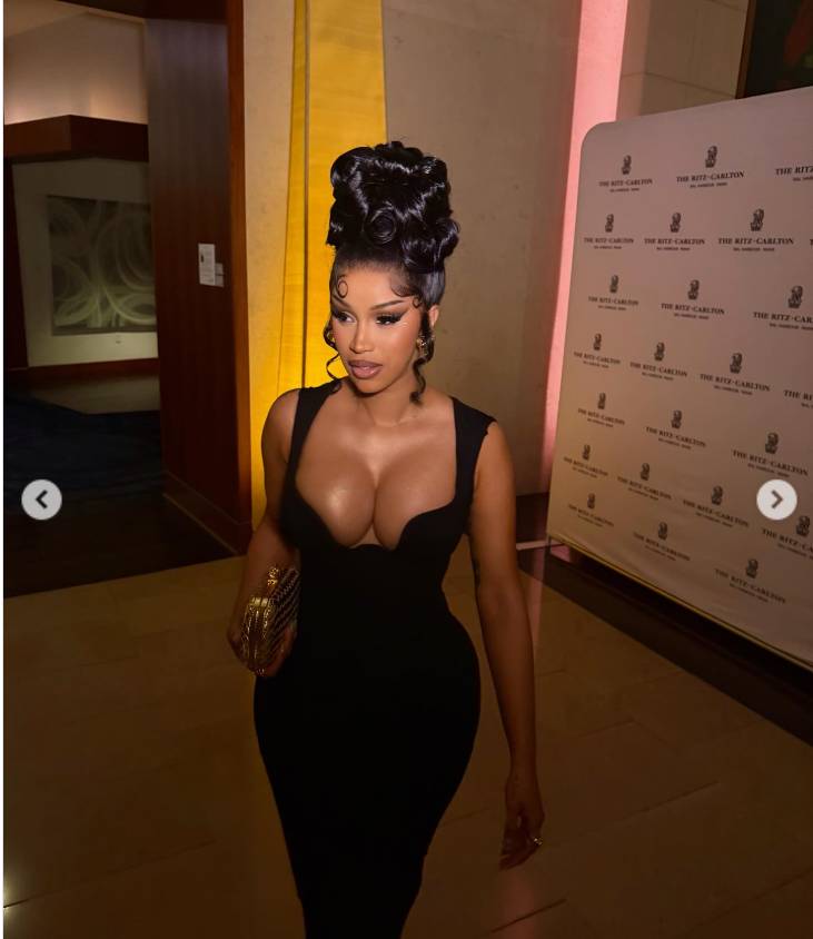 Cardi B exudes confidence as she holds her gold clutch, as seen from a post dated December 8, 2025. | Source: Instagram/iamcardib