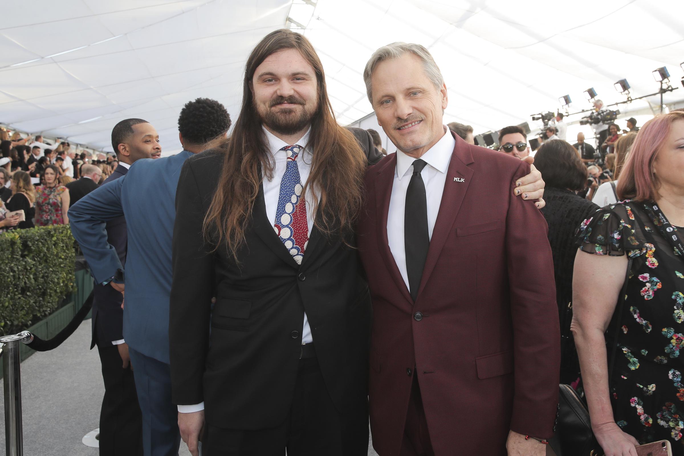 Henry Mortensen joined his father, Viggo Mortensen, at the 25th Annual Screen Actors Guild Awards in Los Angeles, California, on January 27, 2019. While the father-son duo rarely makes public appearances together, the event offered a glimpse of their close bond before Henry's long hair and beard drew comparisons to Viggo's iconic look as Aragorn in "The Lord of the Rings."