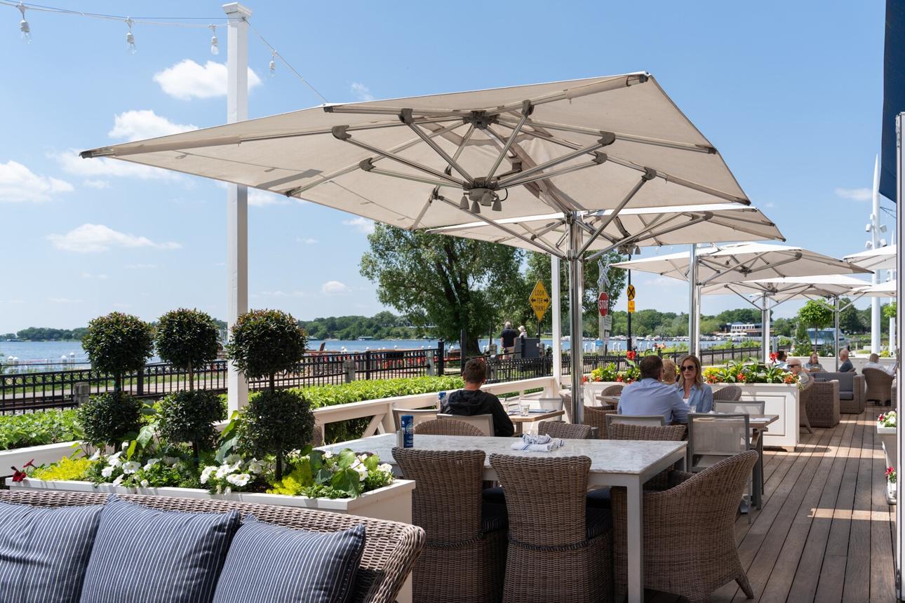 For illustration purposes. Lakeside restaurants line the waterfront in Wayzata, an affluent Minneapolis suburb along the shores of Lake Minnetonka. | Source: ChatGPT