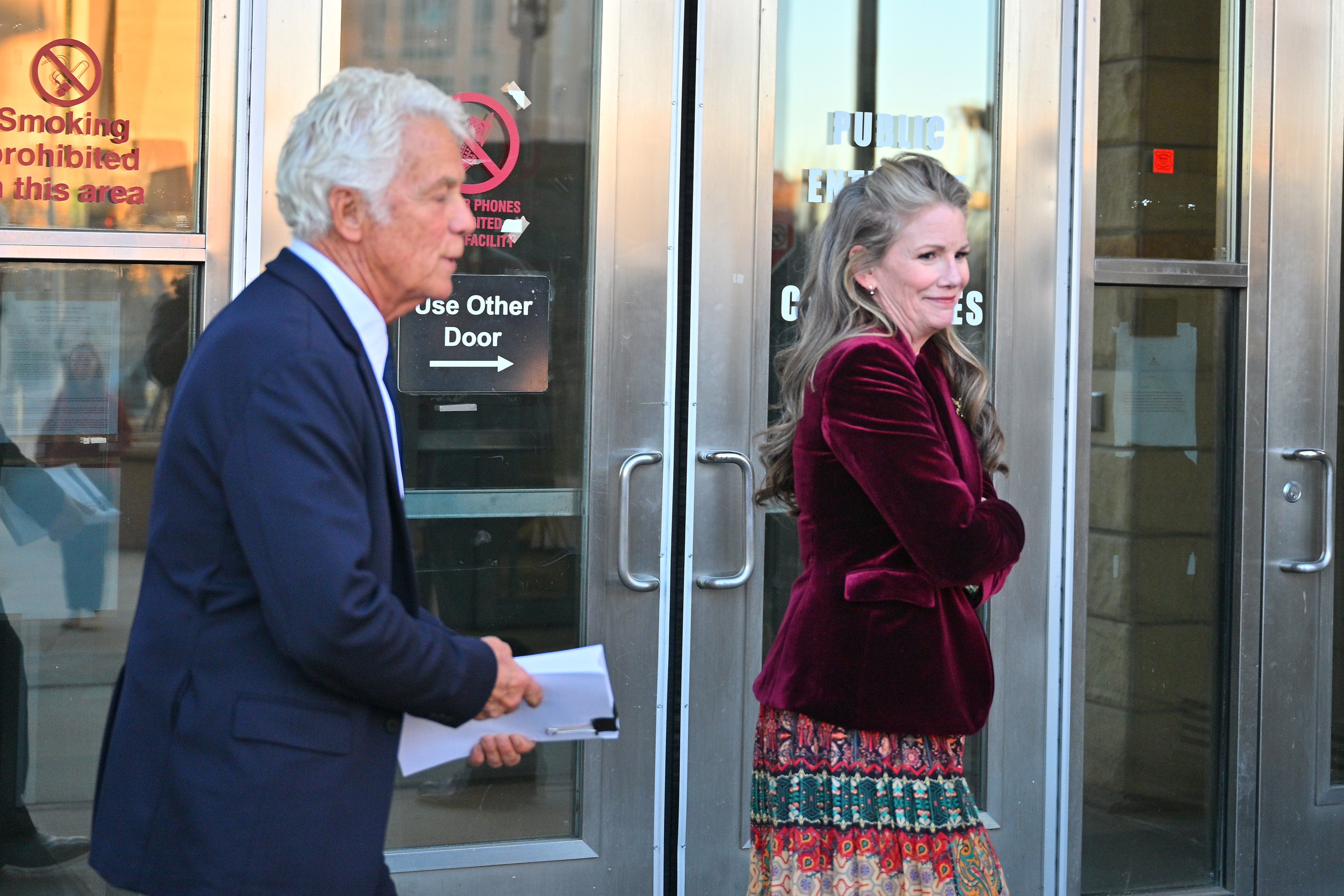 Gilbert's representative said she would not speak publicly about her husband's legal case. On January 20, 2026, the actress was seen leaving a courthouse in Albuquerque with attorney Larry Stein after a judge granted Busfield pretrial release. | Source: Getty Images