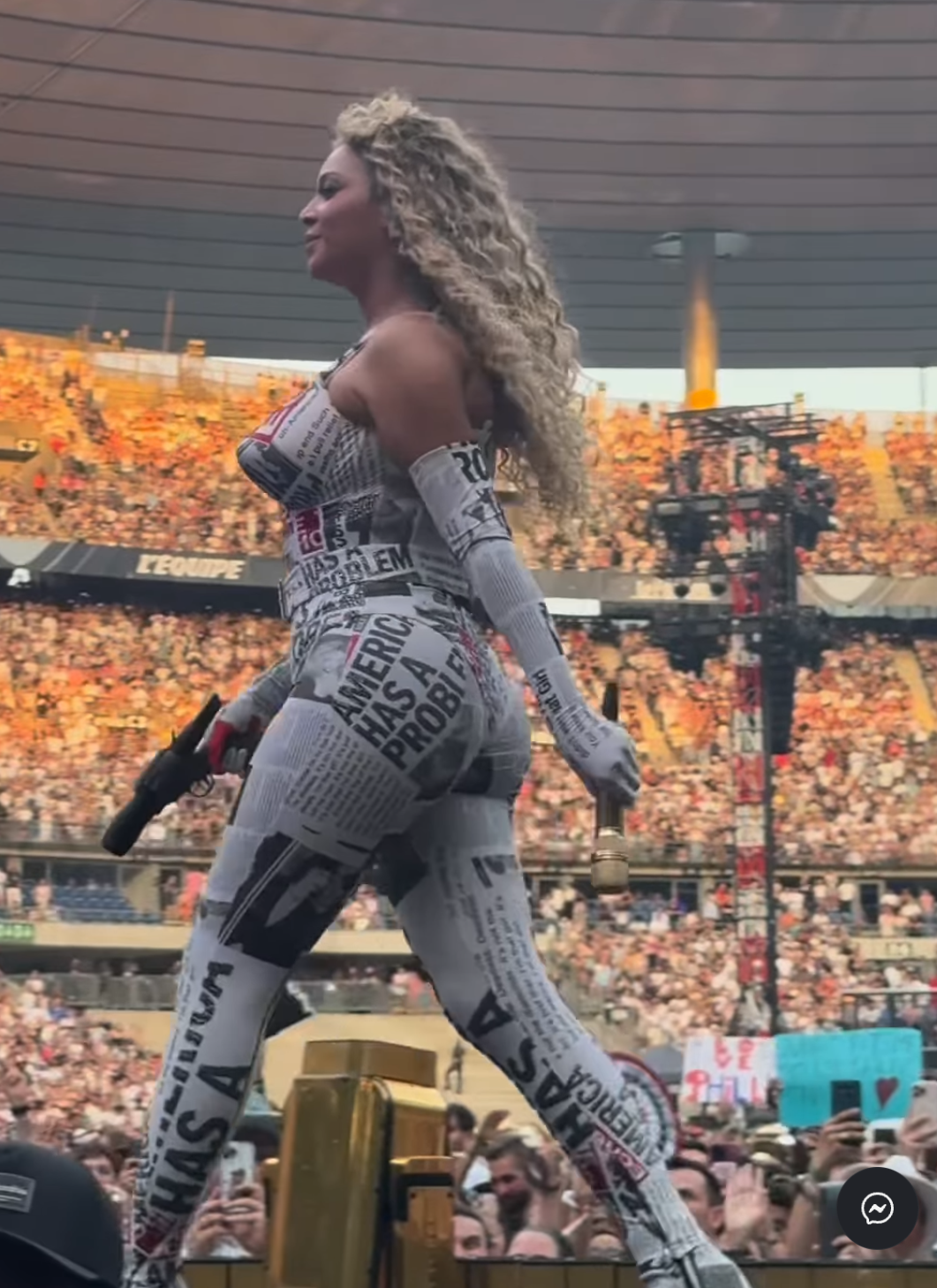 Beyoncé walking across the stage in a custom newspaper-print bodysuit during her concert, dated June 2025 | Source: Instagram/eyesofnilufer
