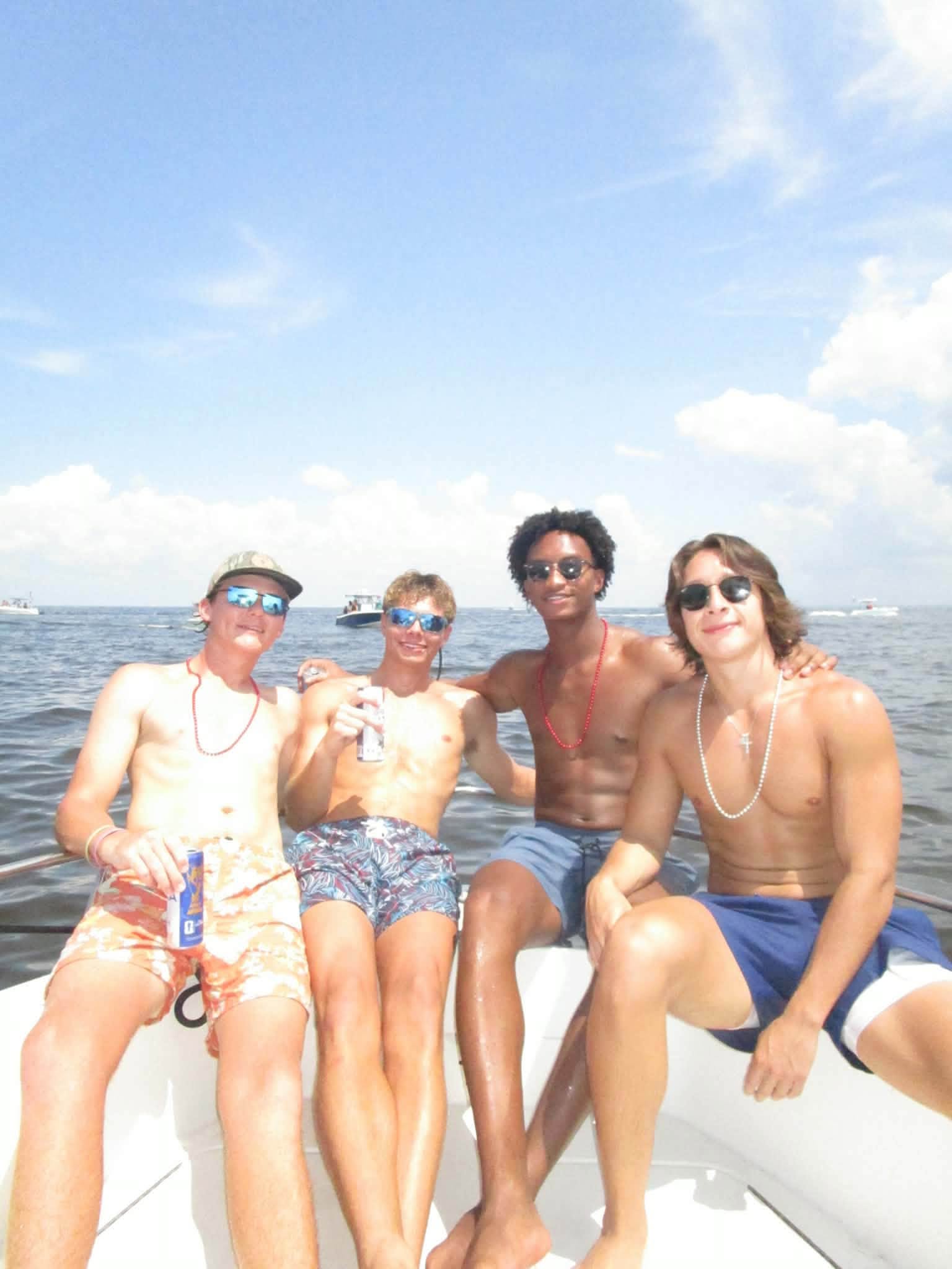 Looking carefree under a clear summer sky, the four friends pose together for a group snapshot. This image is among the final photographs captured before Nolan vanished. | Source: Facebook/christine.wonsley