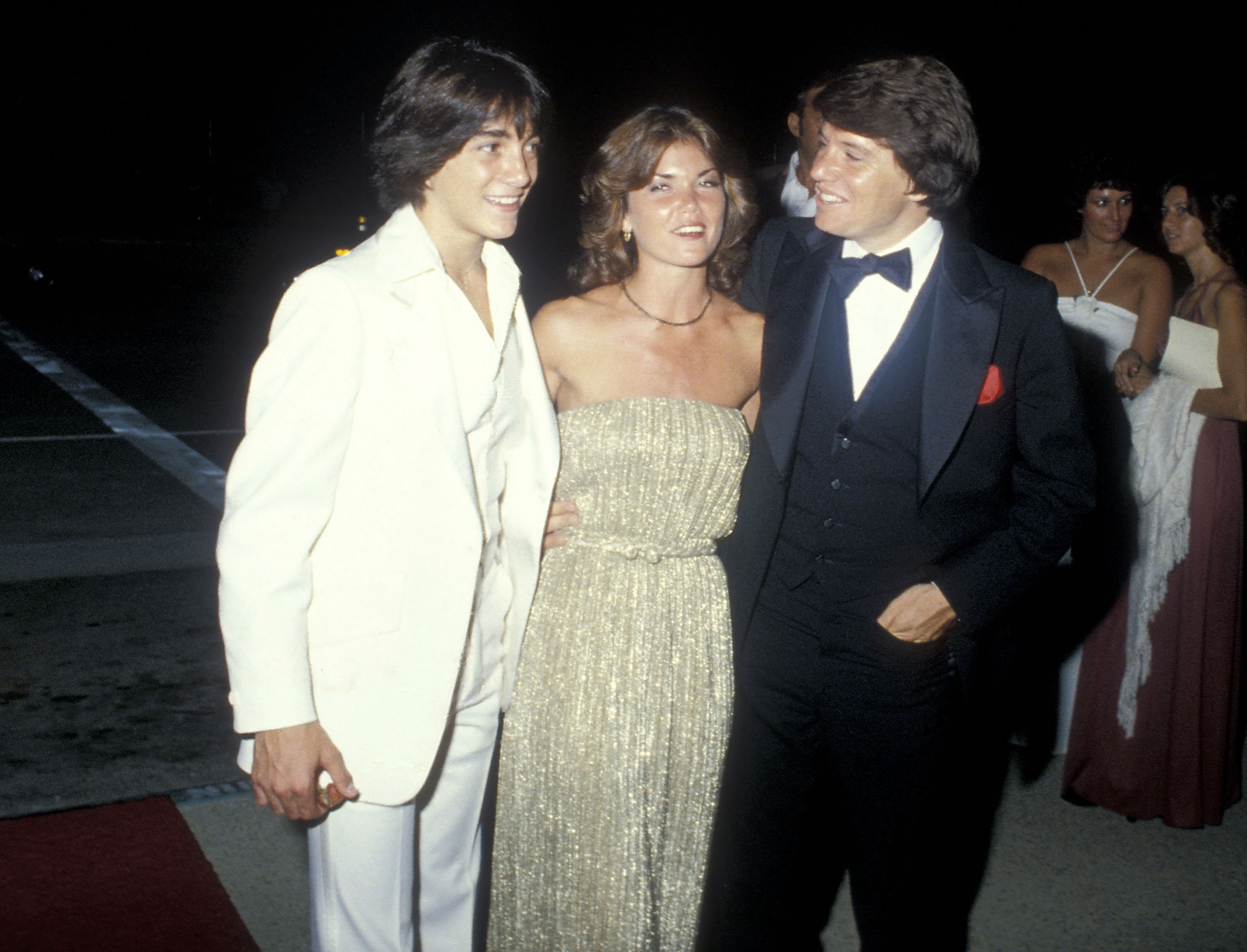 Anson Williams attends a Primetime Emmy Awards event with fellow Happy Days star Scott Baio and his wife, Lorrie Mahaffey. | Source: Getty Images