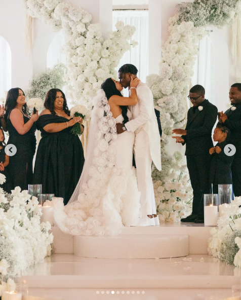 Travis Hunter and Leanna Lenee share a kiss at the altar, dated May 2025 | Source: Instagram/db3_tip