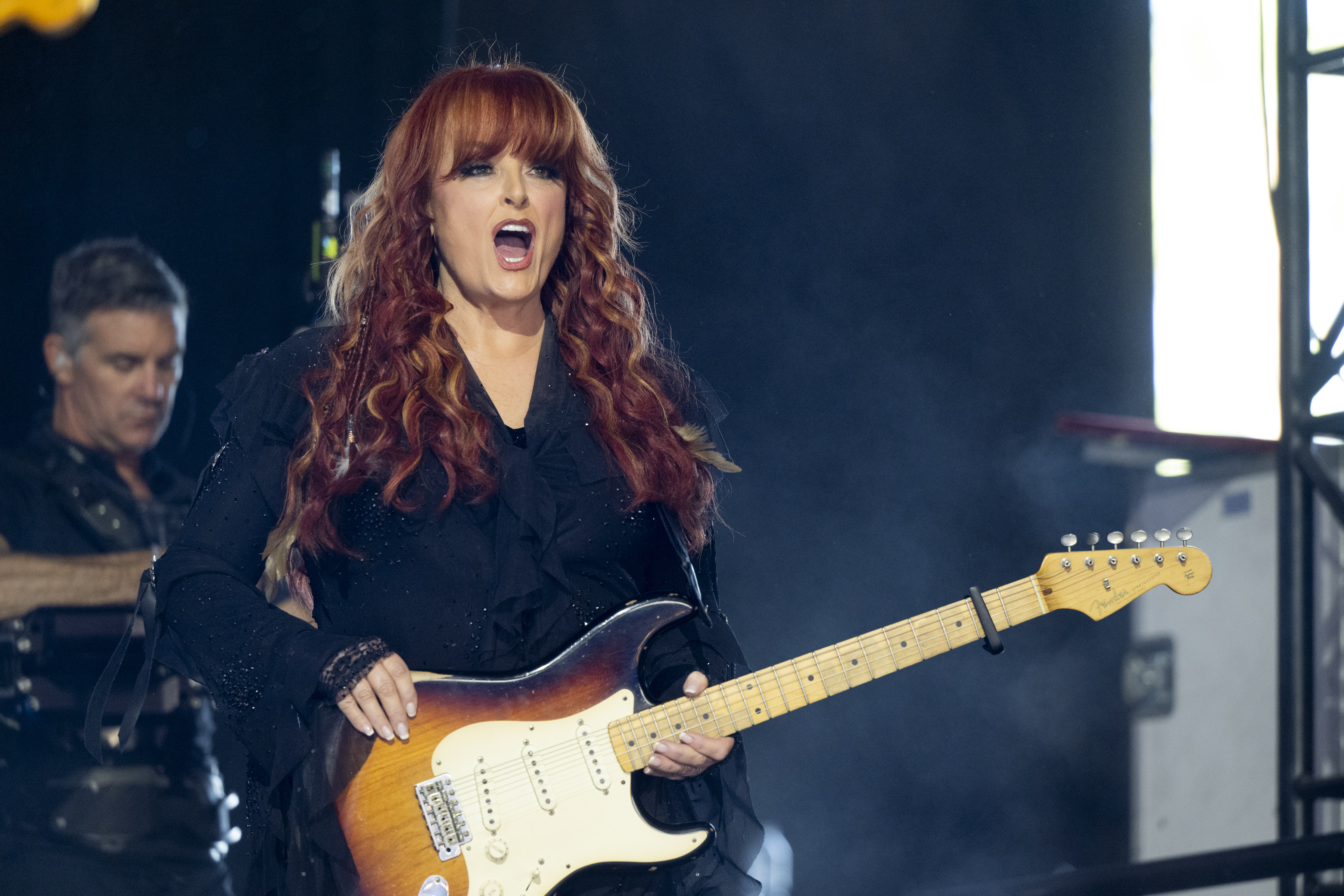 Wynonna Judd performs at the Stagecoach Festival in Indio, California, on April 24, 2026, holding an electric guitar onstage. The appearance captures the performing side of her life, which contrasts with the quieter moments documented in photographs of her Tennessee home. | Source: Getty Images