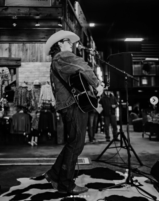 Zuma Rossdale played an acoustic guitar at a microphone in a cowboy hat and denim jacket in an image shared on January 13, 2025. | Source: Instagram/zuma_rossdalemusic