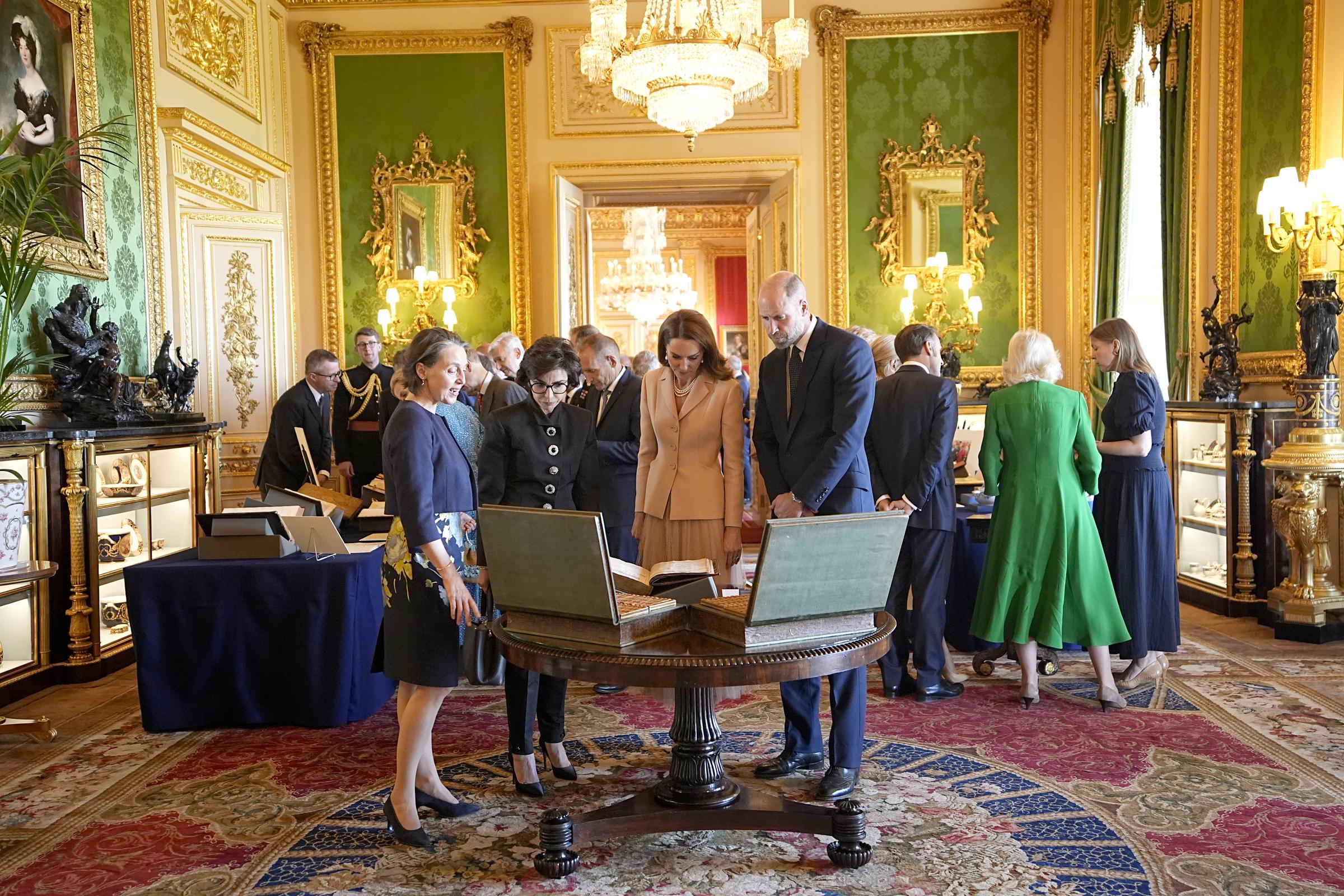 Princess Catherine and Prince William view items on exhibition from the Royal Collection in Windsor Castle on July 8, 2025. | Source: Getty Images