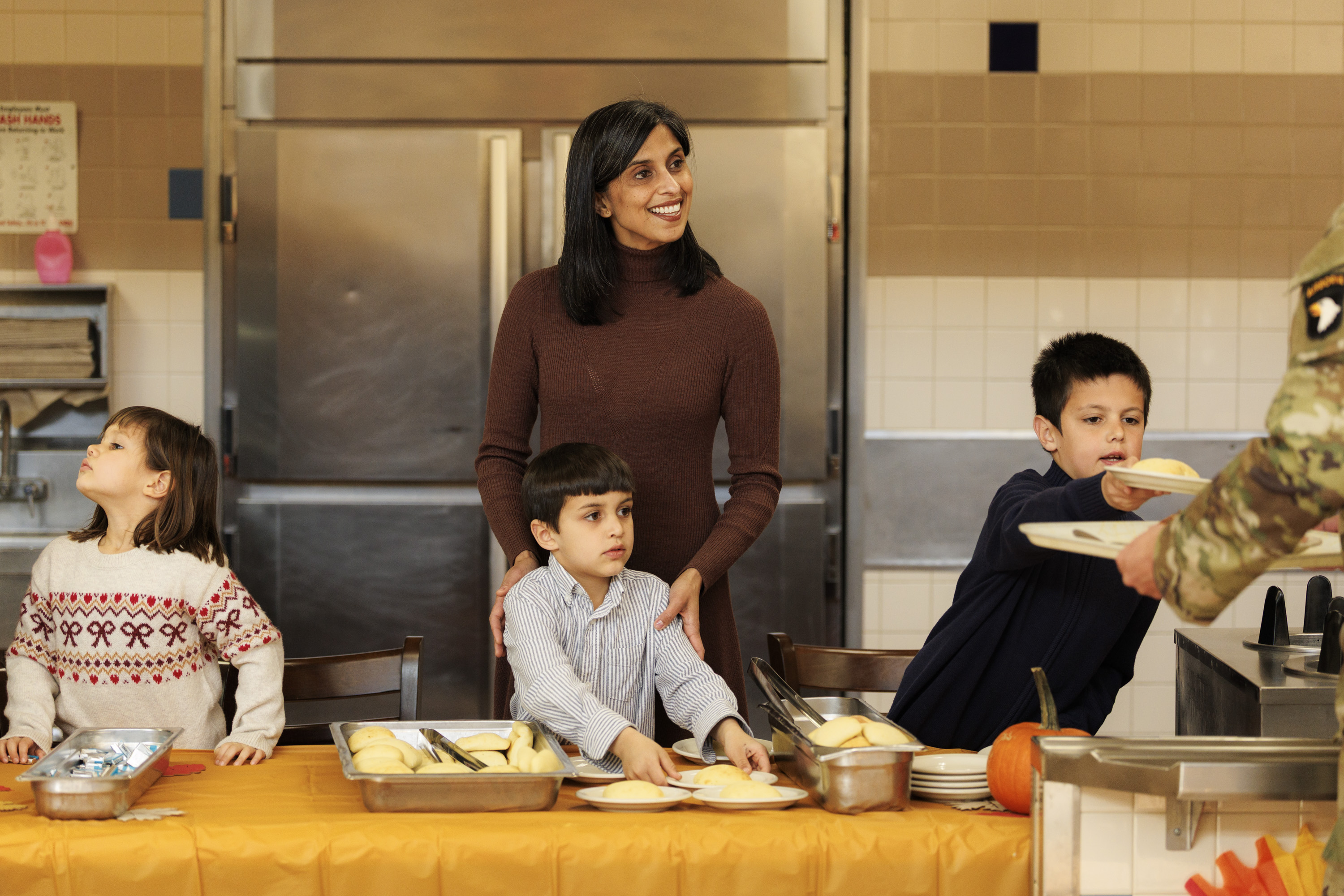 Second lady Usha Vance and children serve members of the 101st Airborne Division in Fort Campbell, Tennessee  on November 26, 2025. | Source: Getty Images