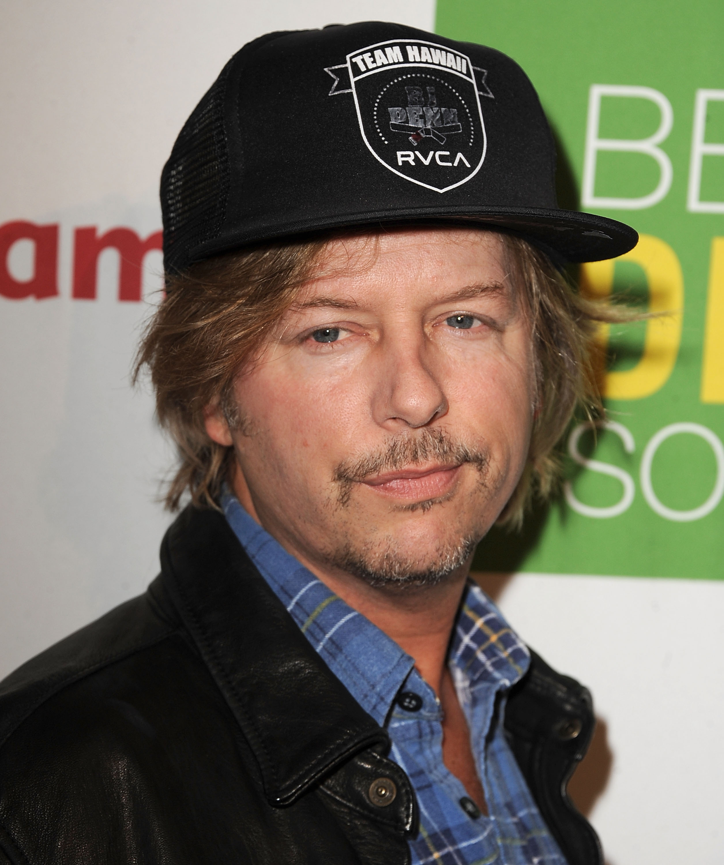 David Spade looked relaxed as he attended the Kimberly Snyder book launch party for "The Beauty Detox Solution" at The London Hotel in West Hollywood, California, on April 13, 2011. With tousled hair peeking from beneath a black Team Hawaii cap and a mustache and goatee framing his face, the comedian displayed some of the features that later made comparisons to Mark Wahlberg's "Father Stu" transformation a recurring theme among netizens.