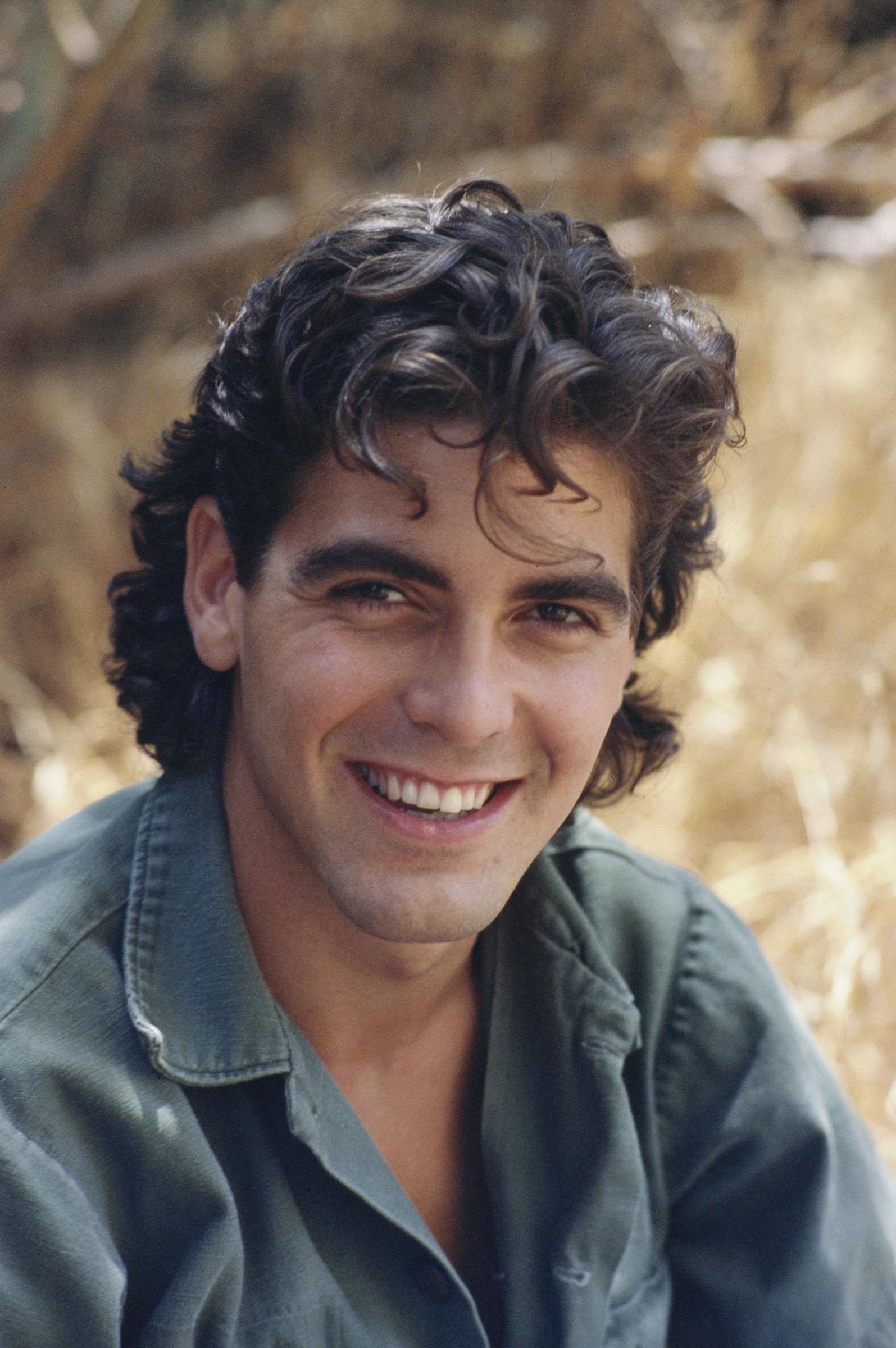 A fresh-faced George Clooney poses during a portrait session in Los Angeles. Taken in May 1985, the image captures the actor at the start of his career, years before becoming a global star.