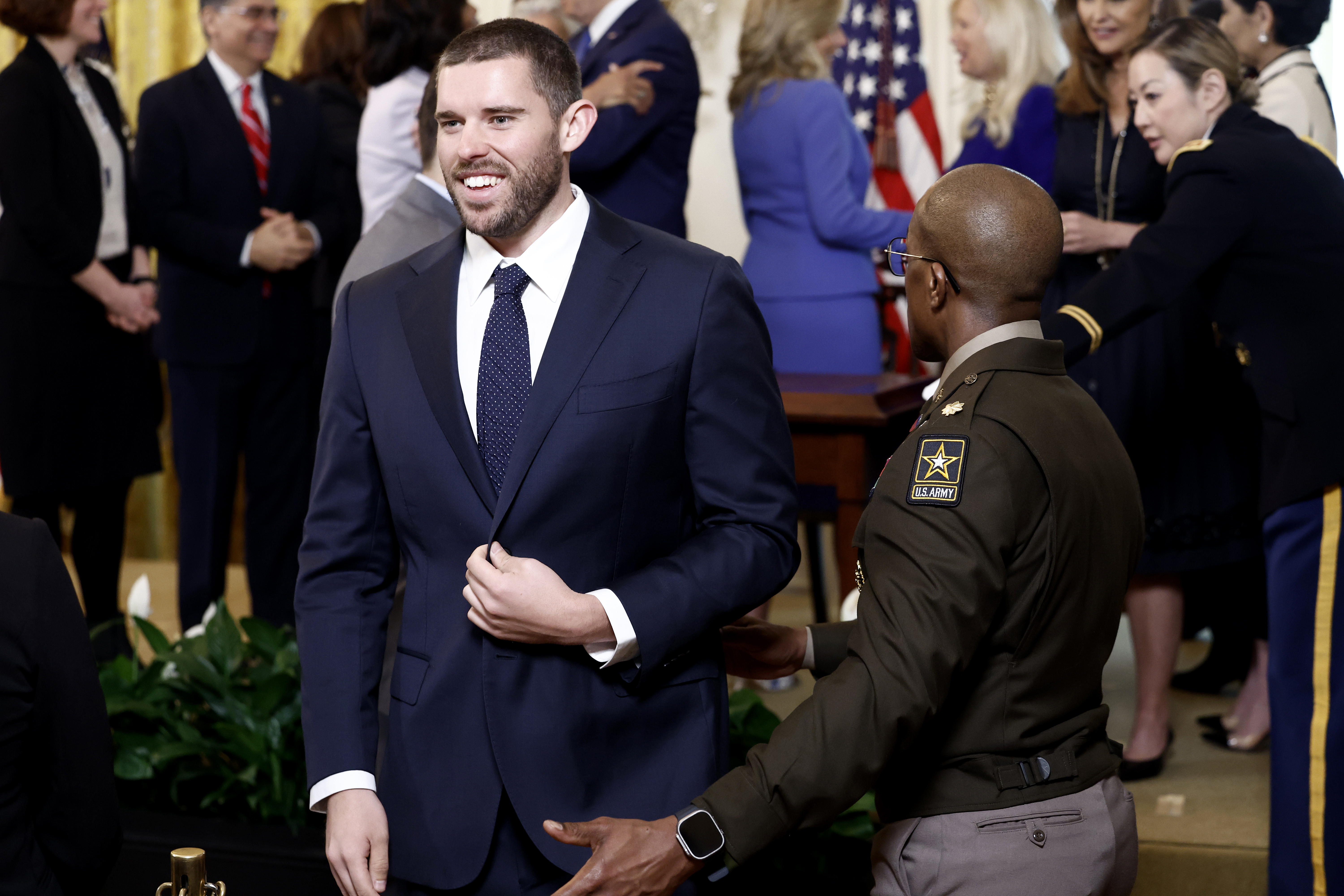 Christopher Schwarzenegger walks offstage after greeting US President Joe Biden at a Women’s History Month reception at the White House on March 18, 2024, in Washington, D.C. | Source: Getty Images