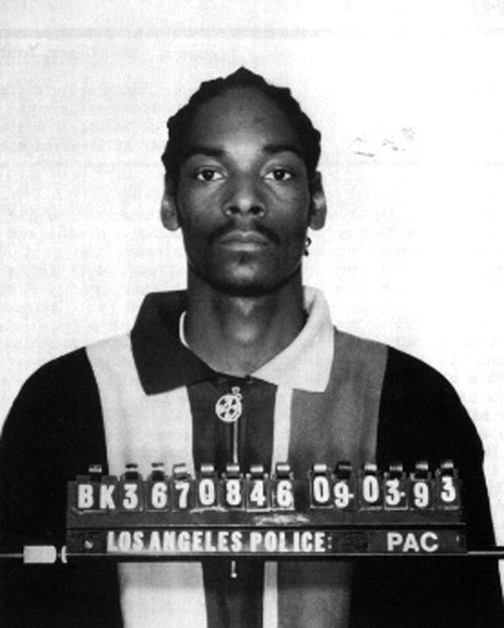 Snoop Dogg posing for his mugshot in 1993. | Source: Getty Images