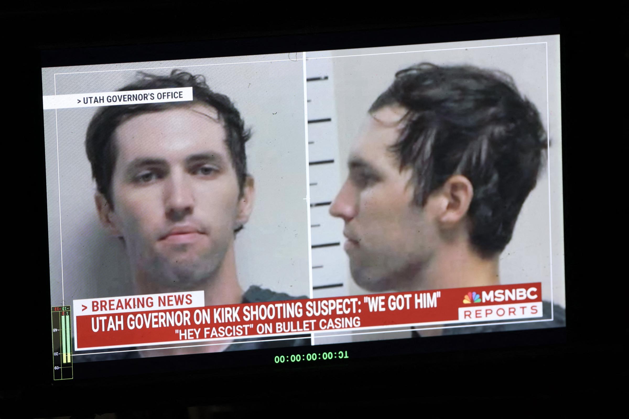 A TV monitor displays a picture of Tyler Robinson on September 12, 2025. | Source: Getty Images