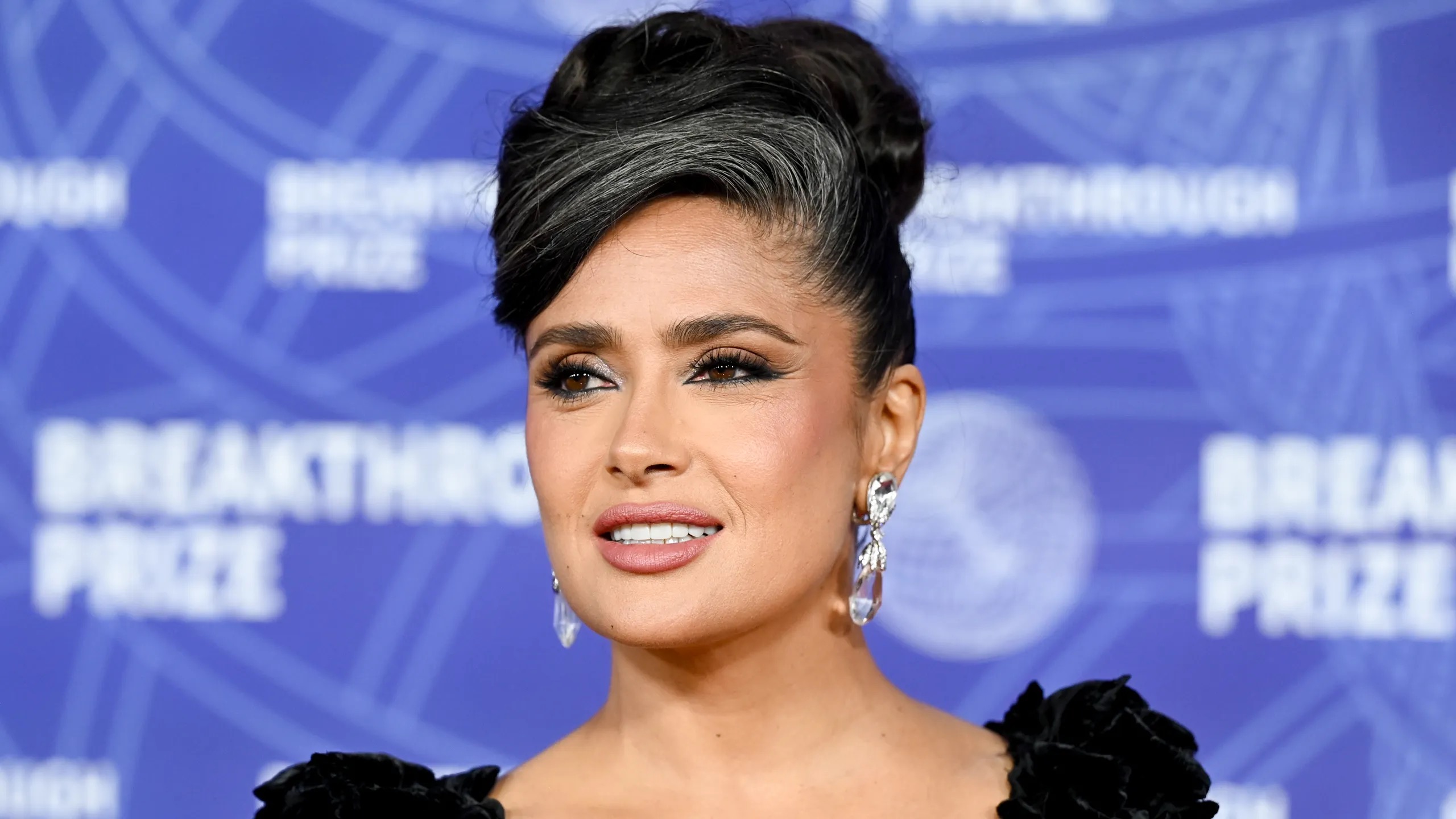 Salma Hayek proudly showed off her silver streaks at the Breakthrough Prize ceremony, proving that even on Hollywood's most glamorous red carpets, gray hair doesn't always need to be hidden. | Source: Getty Images