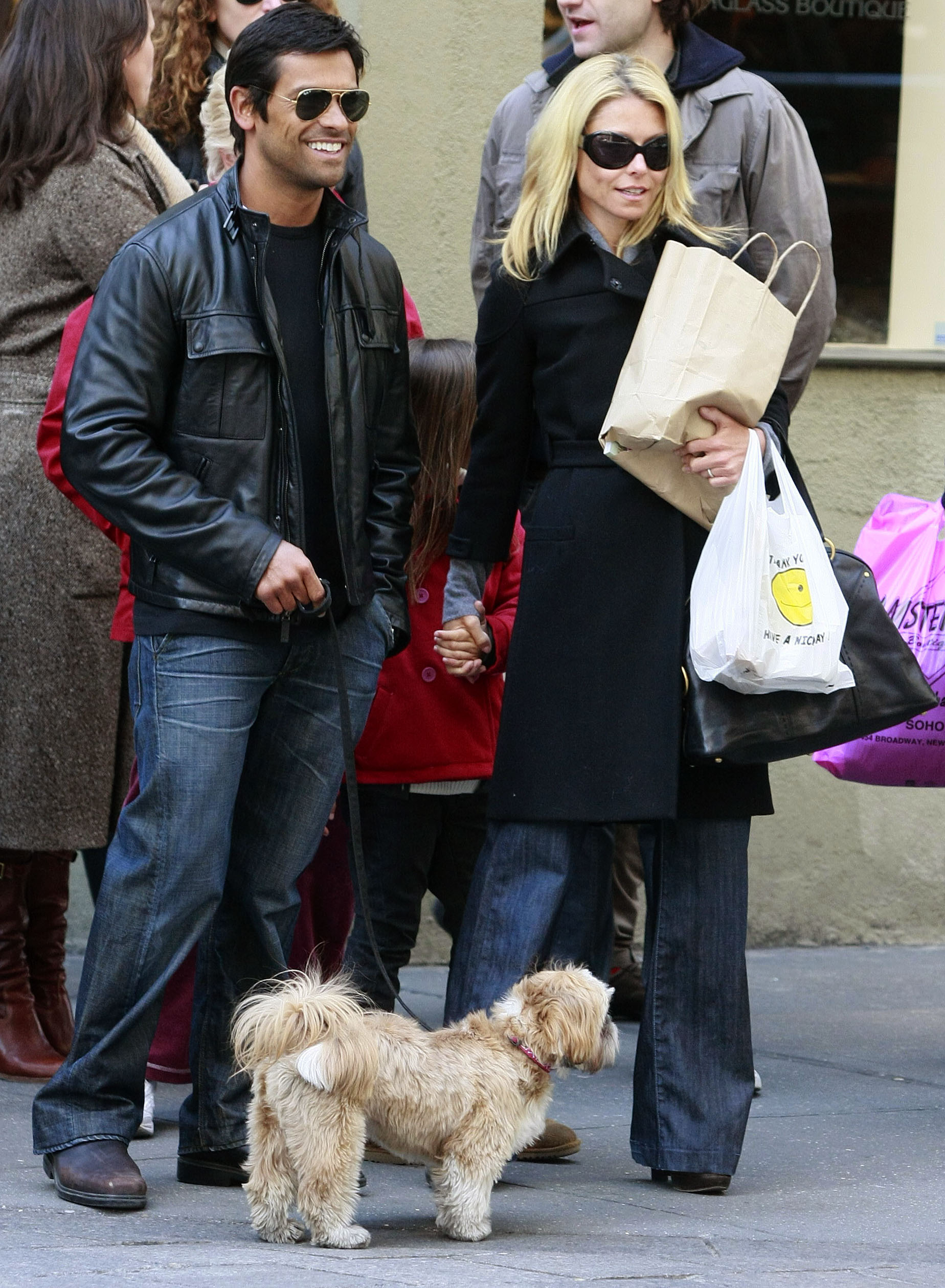 Kelly Ripa and Mark Consuelos enjoy a family outing with their daughter and beloved dog Chewie. After losing their longtime pet in February 2025, the couple hopes welcoming a new puppy will help their family heal while keeping Chewie's memory alive. | Source: Getty Images.